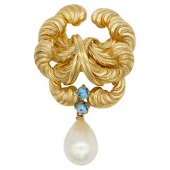 Broche « GROSSE » de Christian Dior, 1964 : modèle emblématique en or, turquoise et perle blanche, en forme de goutte d'eau