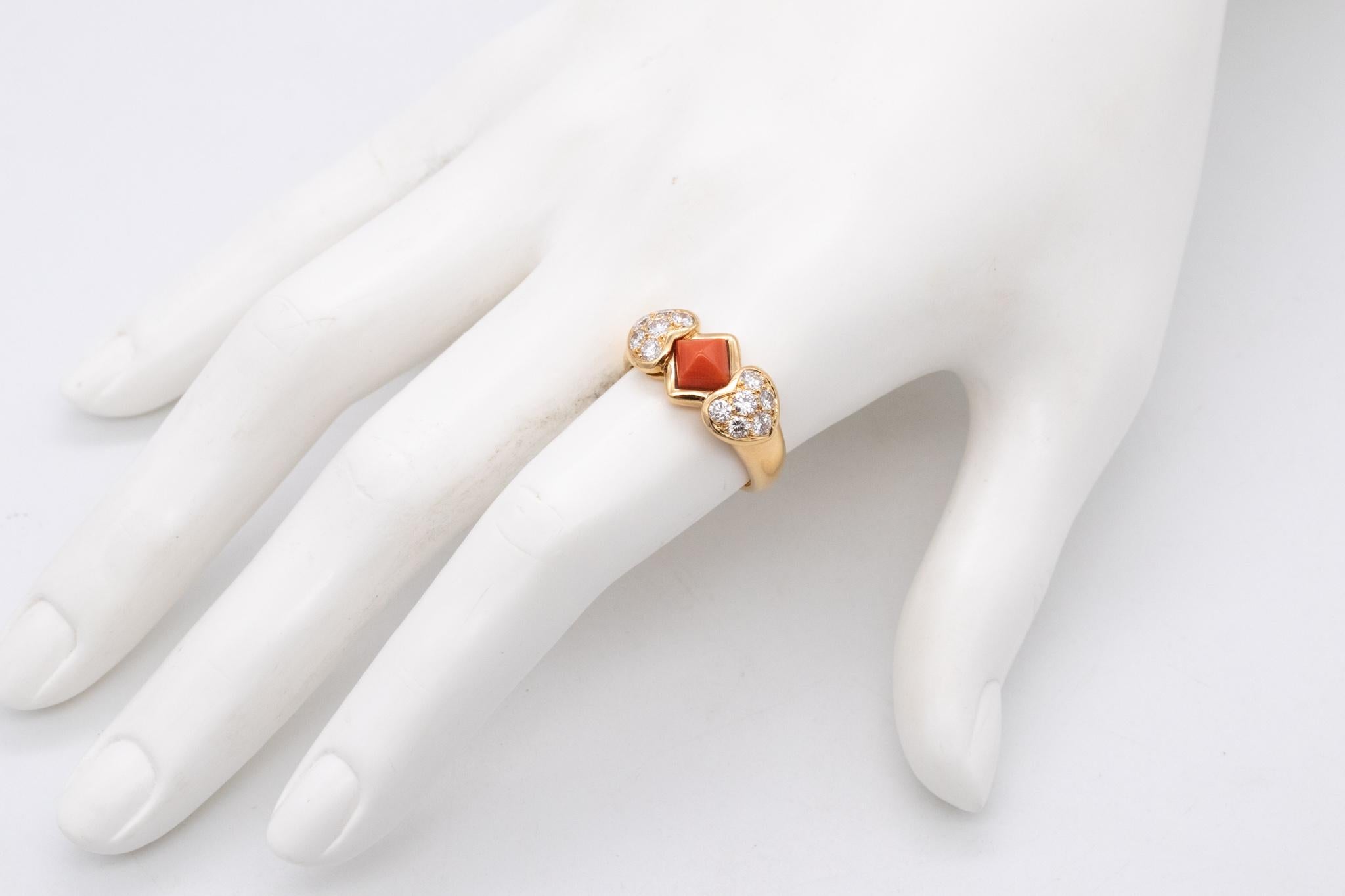 A ring designed by Christian Dior.

Colorful piece, crafted in Paris France in solid 18 karats of high polished yellow gold. Bezel set at top, with a sugar-loaf cabochon cut of a natural salmon coral of about 1 carat.

Is accented at the sides, with