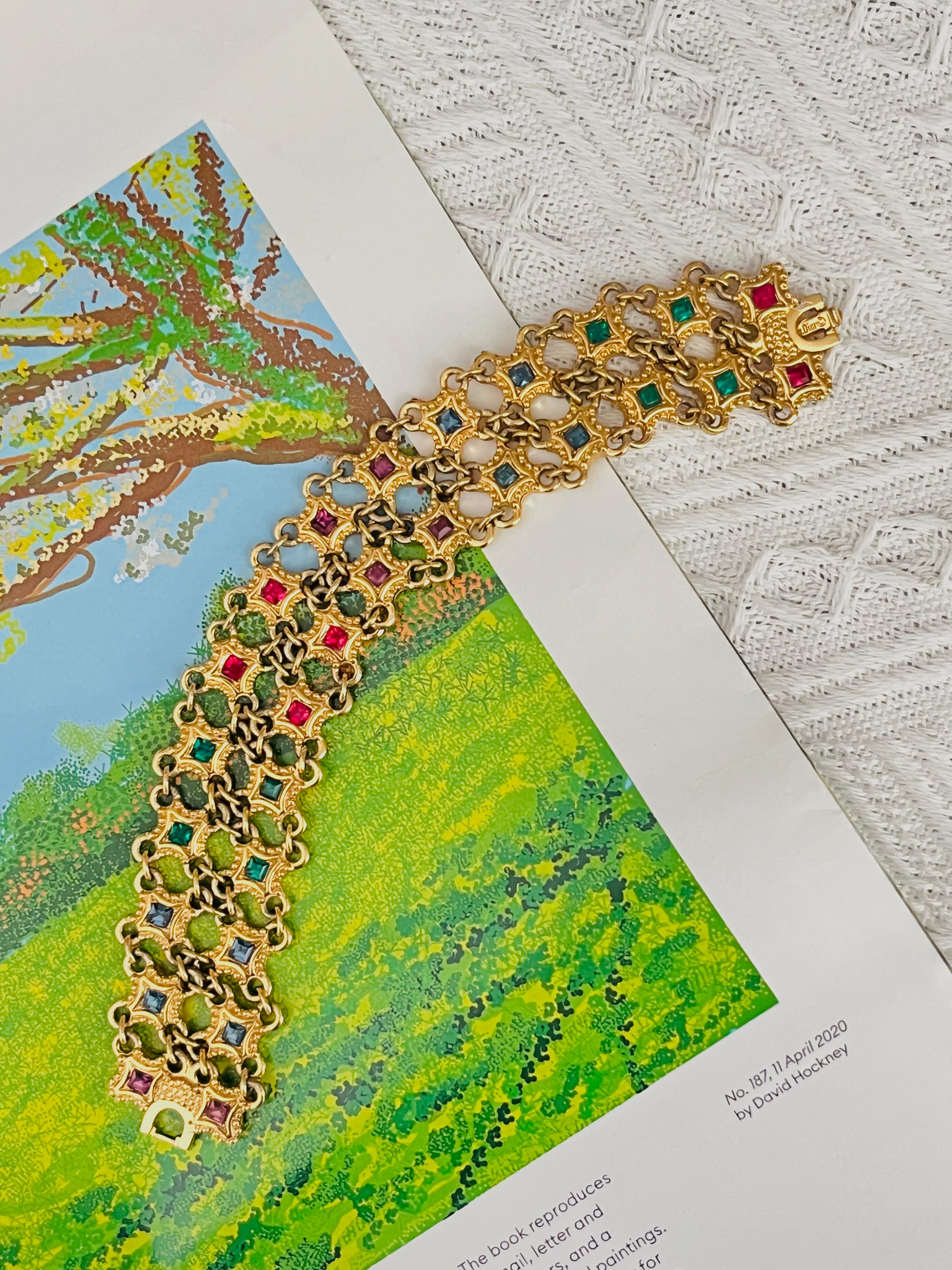Christian Dior 1970s Vintage Baroque Luxury Ruby Sapphire Emerald Amethyst Red Blue Green Purple Crystals Square Double Mesh Openwork Interlocked Wide Modernist Elegant Bracelet, Gold Plated

Very good condition. Not any stones lost. Light scratches