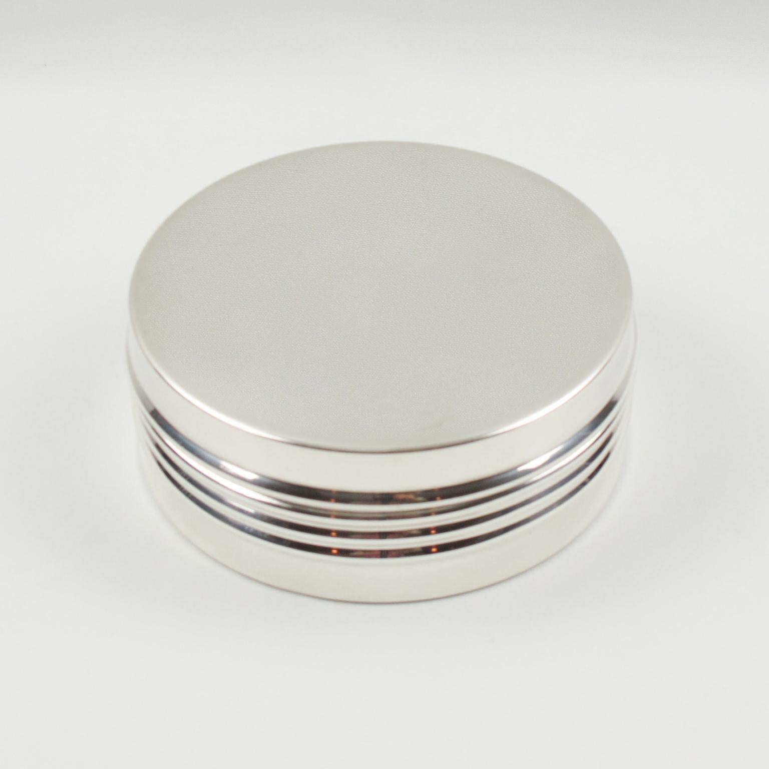 Beautiful modernist silver plate decorative box designed by Christian Dior for his home collection. Elegant minimal rounded shape with lid and refined carved ornamental gadrooning pattern all around. Marked underside 