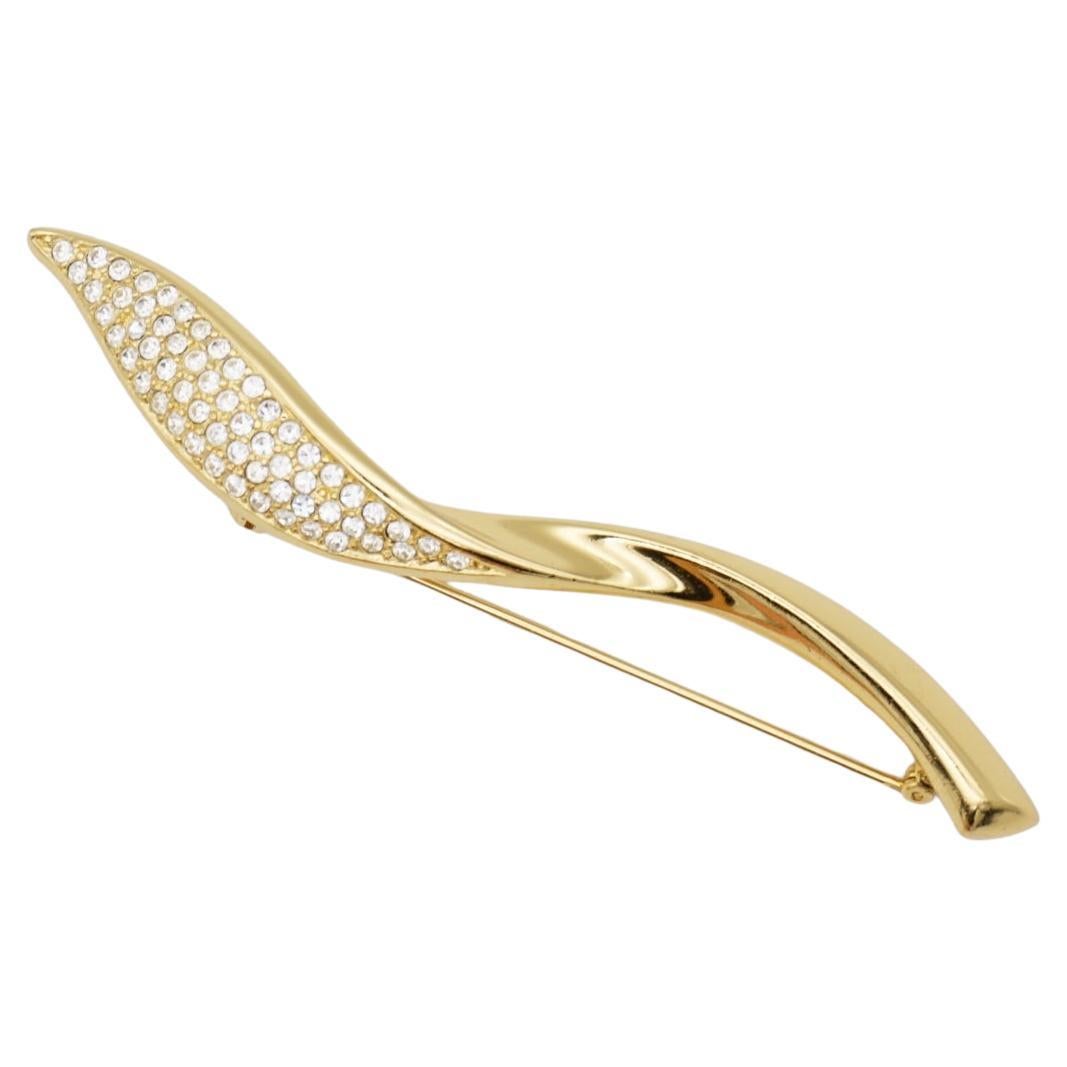Christian Dior 1970s Vintage Extra Long Glow Crystals Spiral Twist Leaf Flame Modernist Brooch, Gold Tone

Very excellent condition. Very new. 100% Genuine.

A unique piece. This gold plated stylised brooch. Safety-catch pin closure, signed on the