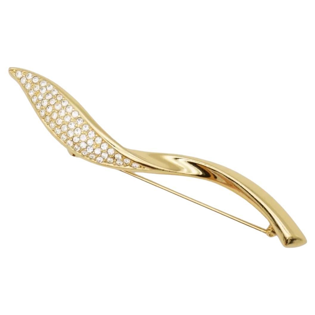 Christian Dior 1970s Vintage Extra Long Glow Crystals Spiral Twist Leaf Flame Modernist Brooch, Gold Tone

Very excellent condition. Very new. 100% Genuine.

A unique piece. This gold plated stylised brooch. Safety-catch pin closure, signed on the