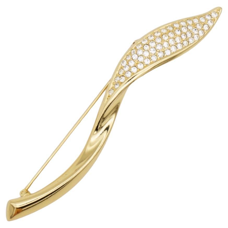 Christian Dior 1970s Vintage Extra Long Swirl Leaf Crystals Modernist Brooch, Gold Tone

Very excellent condition. Very new. 100% Genuine.

A unique piece. This gold plated stylised brooch. Safety-catch pin closure, signed on the back.

Size: 9.8 cm