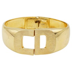 Christian Dior 1973 Logo CD Manschette Braccialetto d'oro con braccialetto a forma di manico grosso