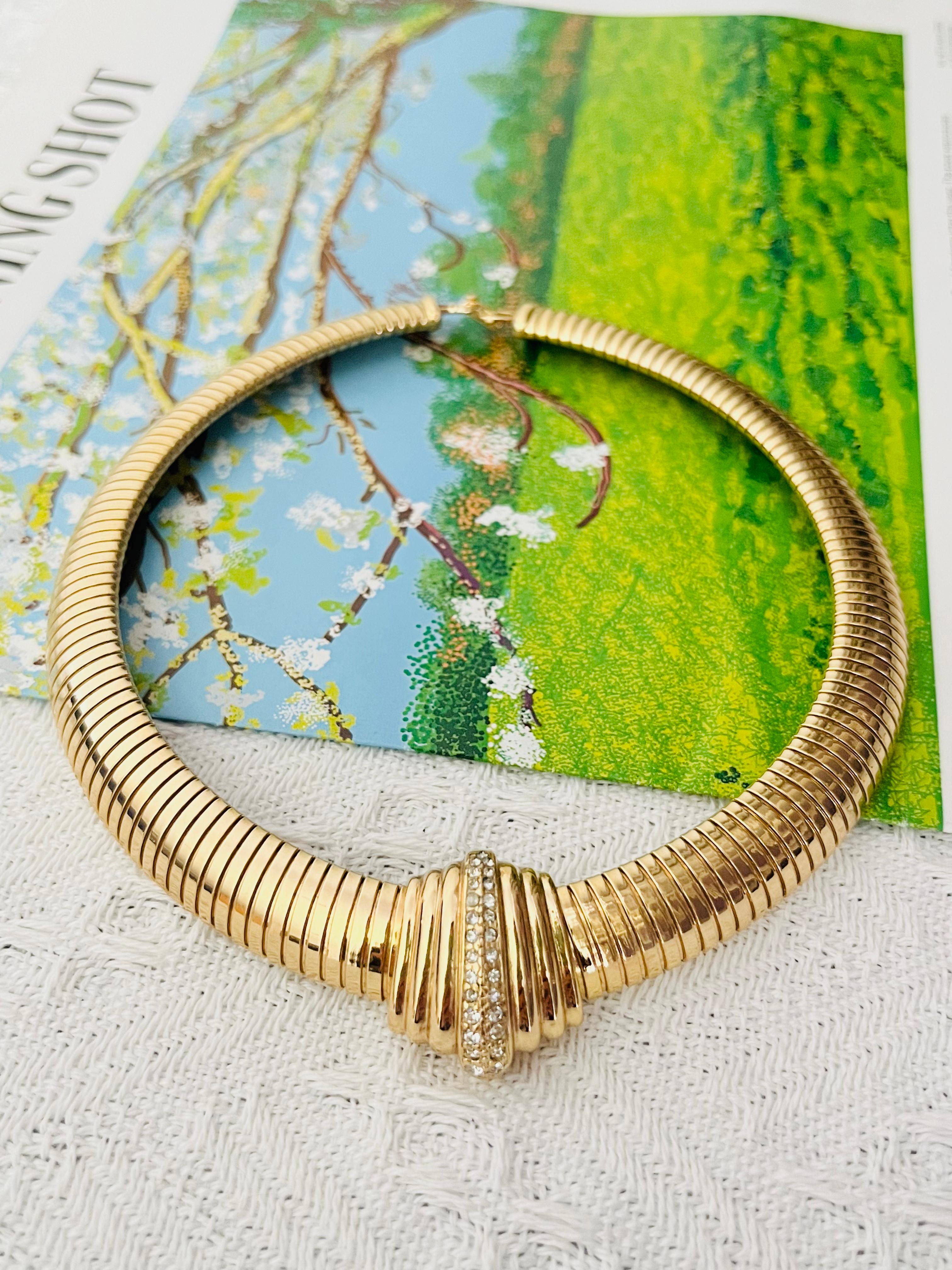 Christian Dior 1980 Vintage Extra Wide Crystals Wide Ribbed Omega Chunky Pendant Ribbed Adjustable Choker Omega Chunky Necklace, Gold Tone

Very good condition. Very light colour loss or scratches, barely noticeable. 100% Genuine. 

It is over 50