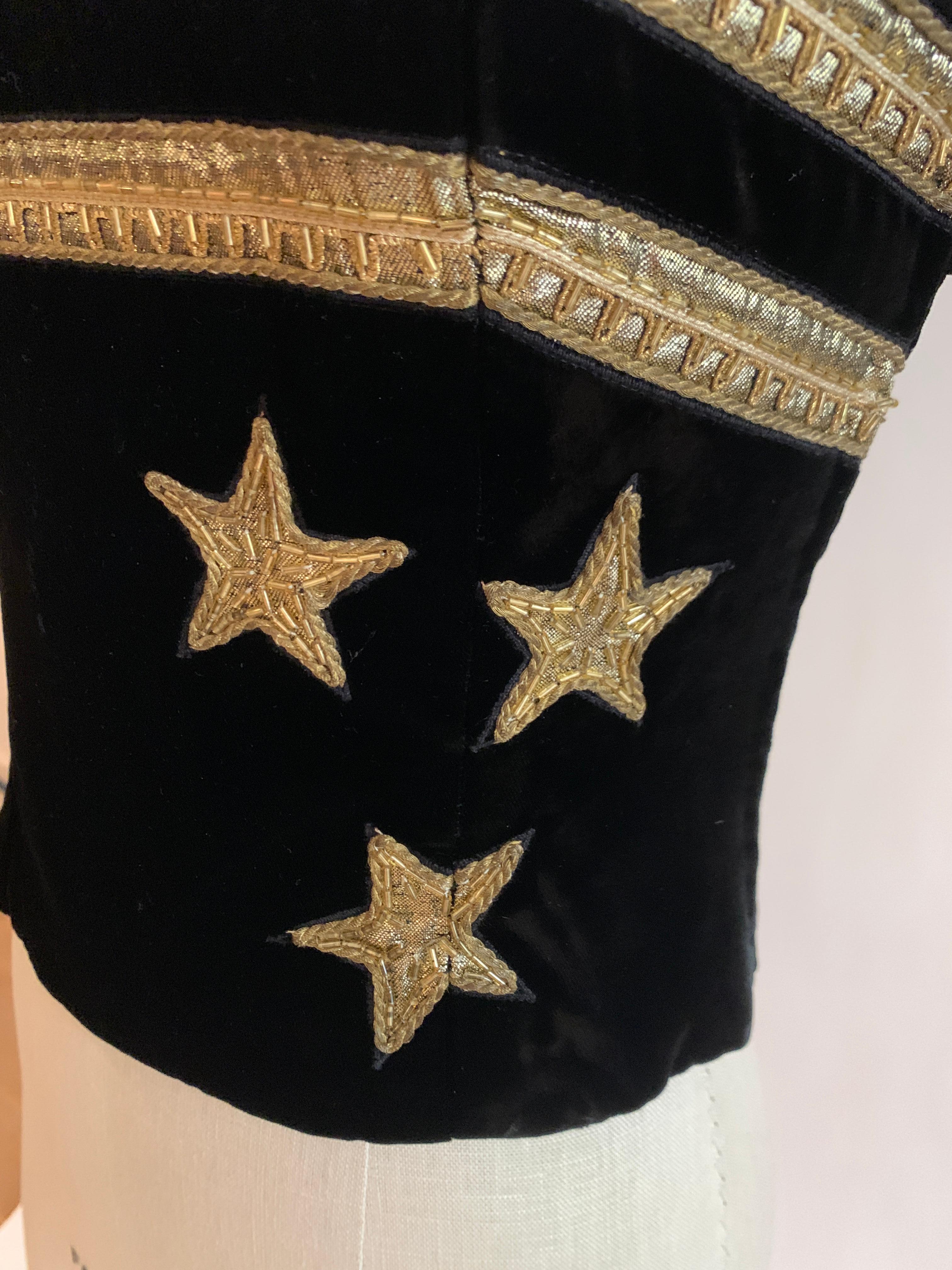 Christian Dior Boutique late 80s/early 90s black velvet corset with gold beaded appliqué star detail and trim at bust. Strapless top closes with side zip and hook and eye. (Photo note: zipper is not zipped all the way up on our mannequin- it is a