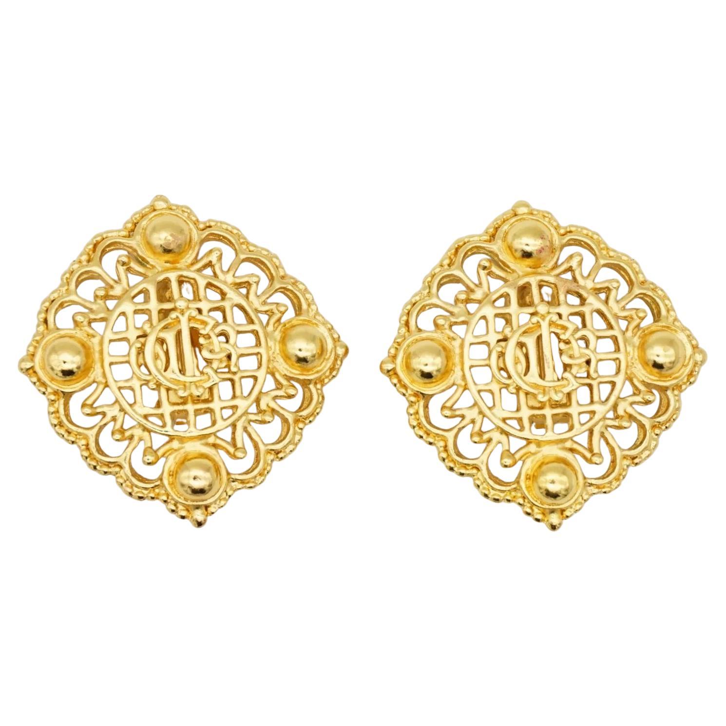 Christian Dior 1980s Vintage Unisex Massive Huge Logo Monogram Insignia Crest Openwork Modernist Clip Earrings, Gold Plated

Very excellent condition. Not any colour loss or scratches. Marked 'Chr.Dior (C) '. 100% Genuine.

Only some black on one