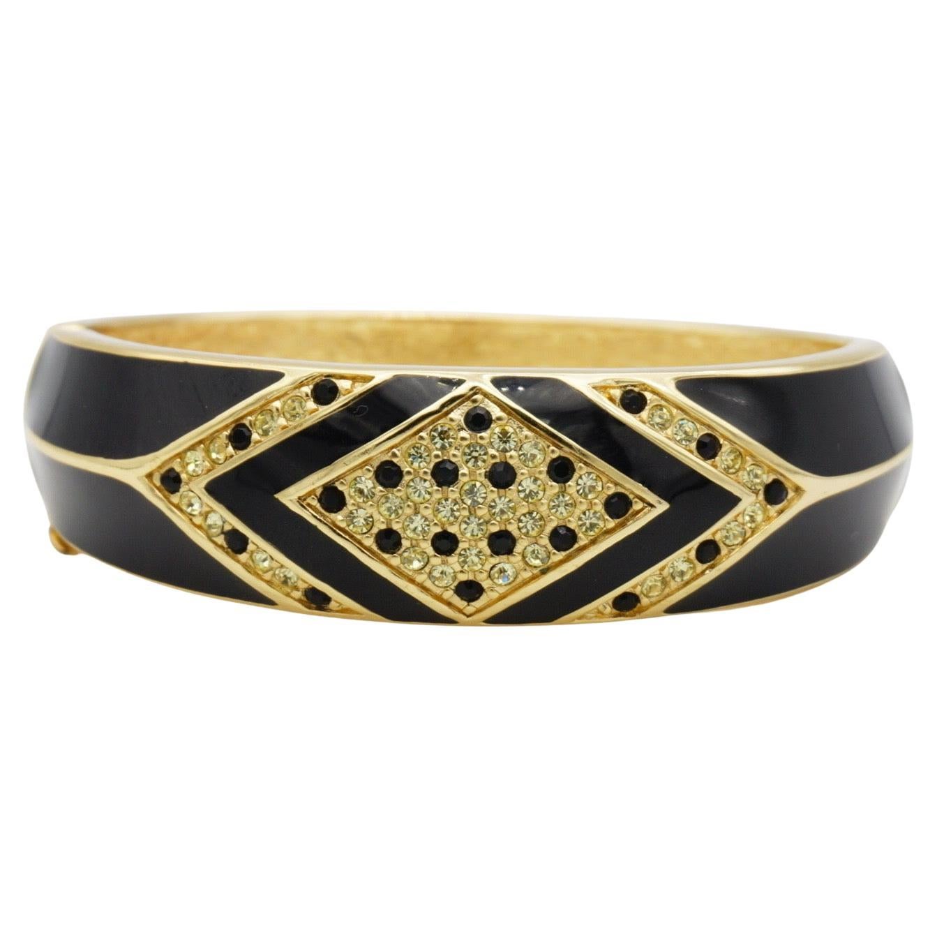 Christian Dior 1980s Vintage Unisex Geometric Black Enamel Shining Clear Crystals Modernist Cuff Bangle Bracelet, Gold Tone

Very excellent condition, only some tiny dark spots inside, others are perfect. 100% Genuine.

A very beautiful bracelet by