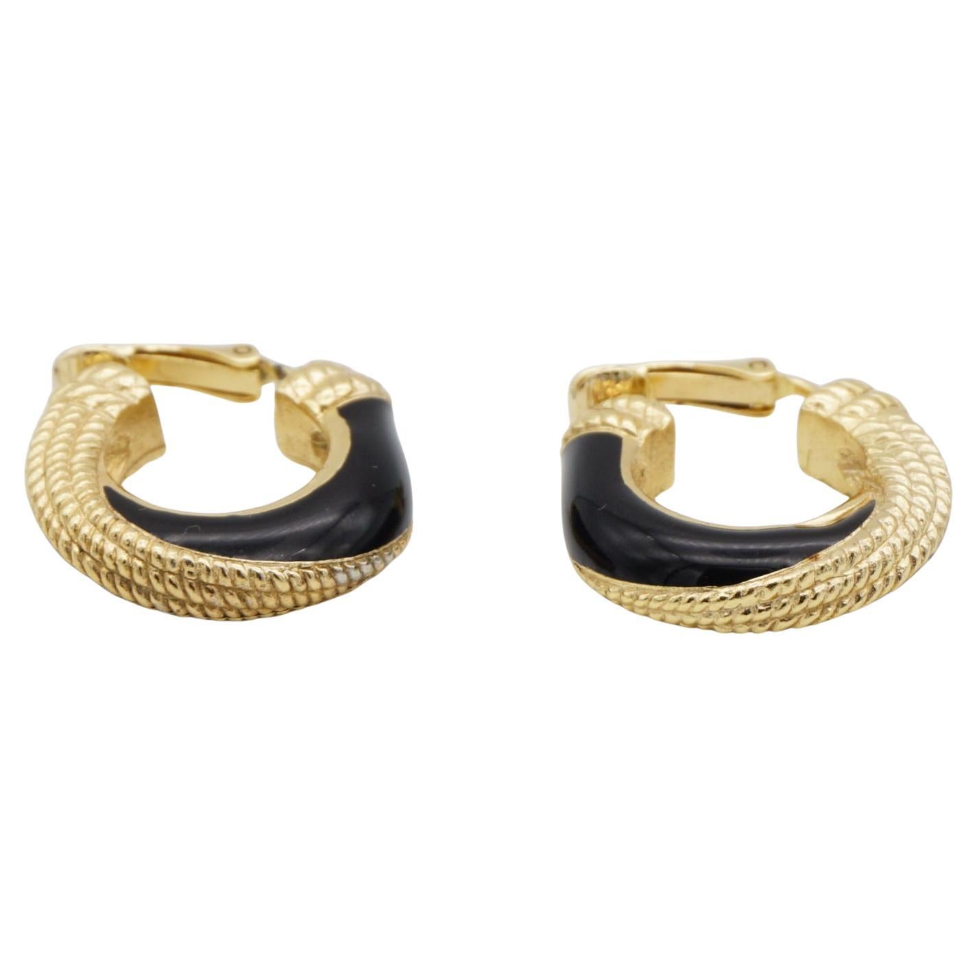 Christian Dior 1980s Vintage Unisex Black Enamel Spiral Twist Dots Rope Demi Semi Dome Hoop Clip Earrings, Gold Tone

Very good condition. Light scratches or colour loss, barely noticeable. 100% genuine. Rare to find.

A very beautiful pair of clip