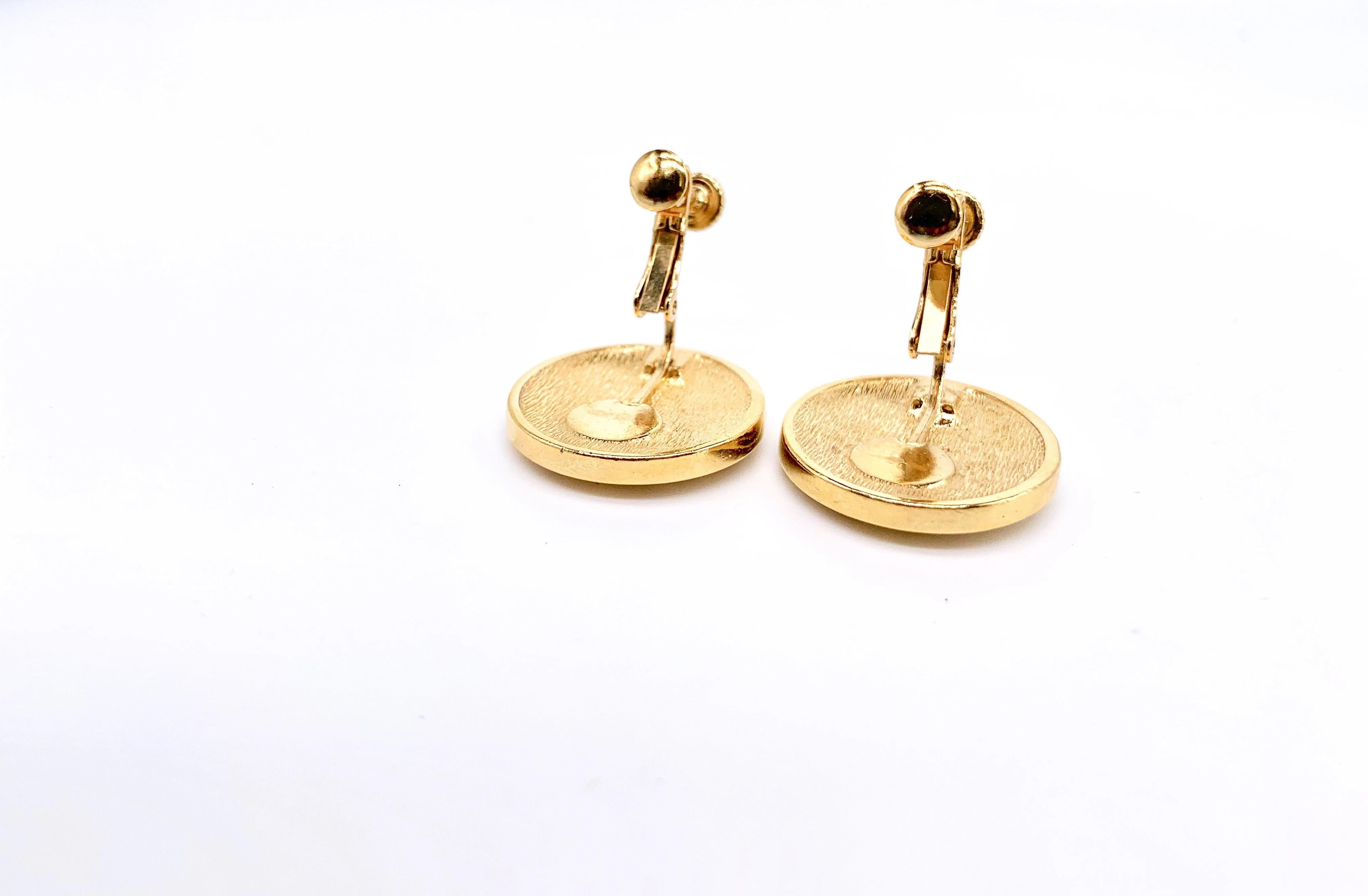 Christian Dior 1980s Vintage Earrings

Details
-Made in the 1980s in Germany 
-Cast from gold plated metal
-Feature the iconic Christian Dior 'CD' initials
-Screw back closure

Size & Fit
Approximately 2.54cm/1inch across, 

Style Notes  
Super
