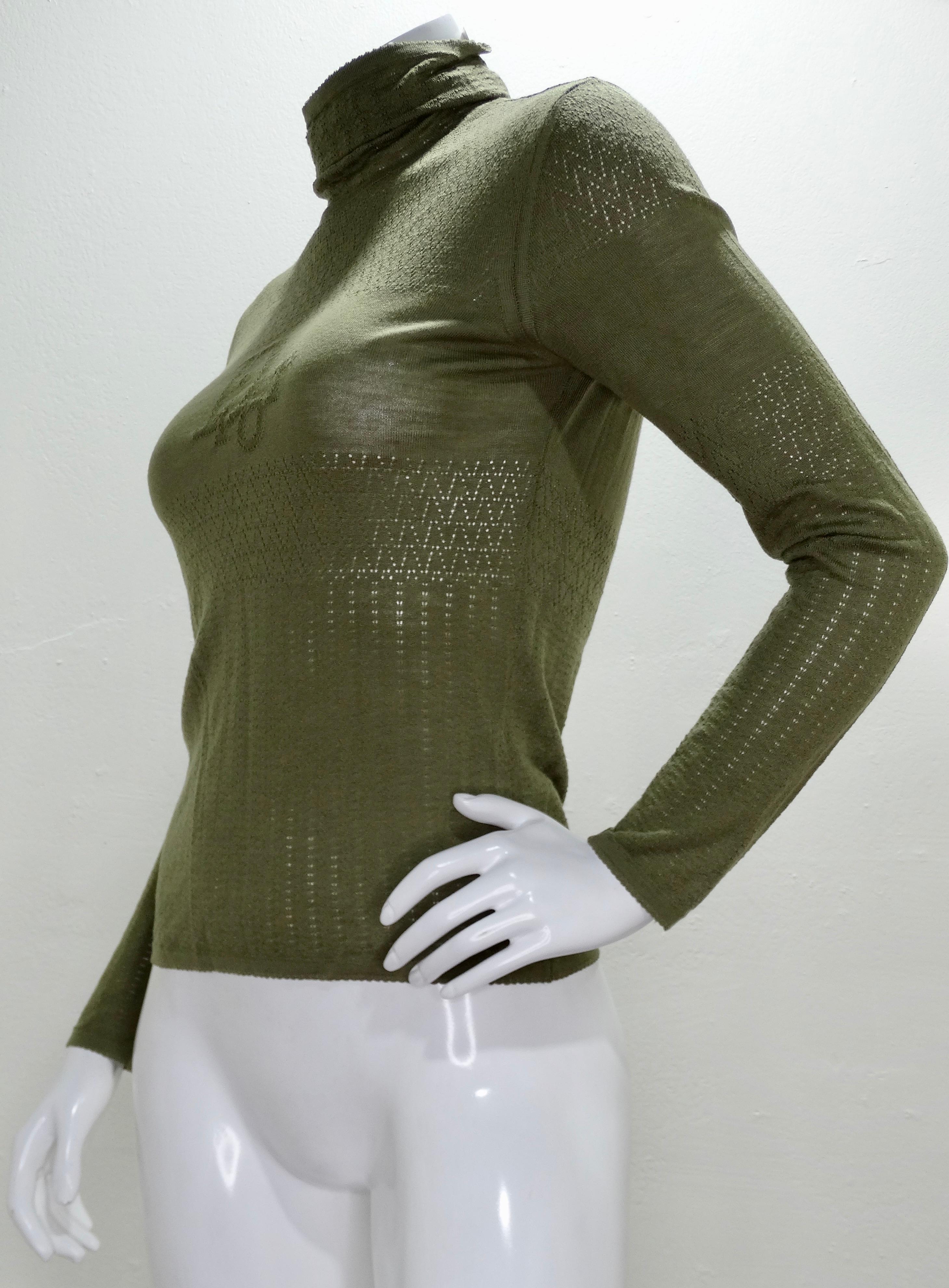 Take a piece from the Dior archives with this adorable turtle neck! Circa early/mid 1990s, this wool sweater is an olive green color and features a subtle crochet pattern with 'Dior' in the middle on the front and back. Marked a US size 6, best fit
