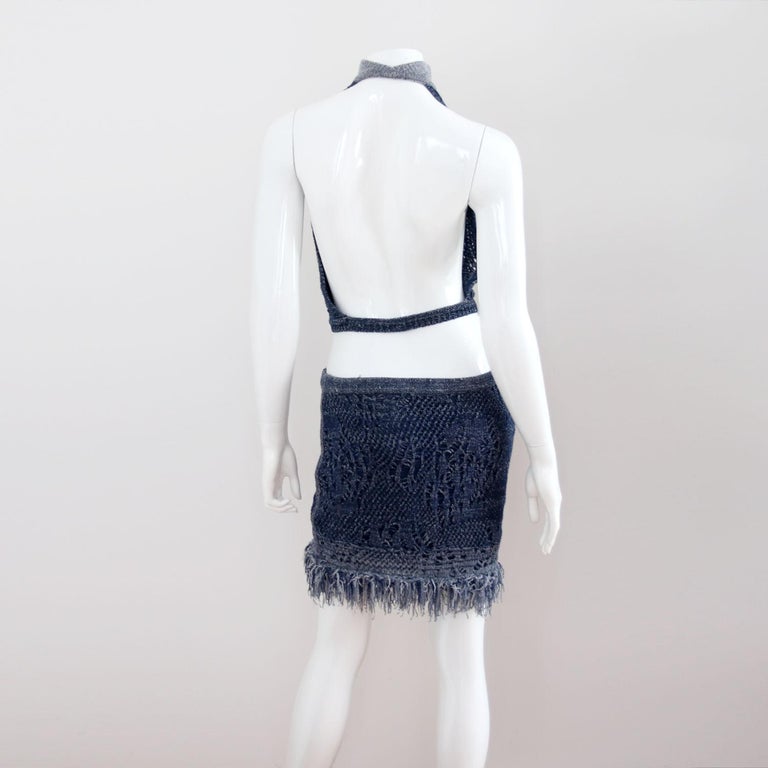 CHRISTIAN DIOR

2000. Sheer Blue Knit Top & Skirt Set from Christian Dior by John Galliano.
The top closes at the front of the collar with a hook and eye. The skirt has a blue lining. The size is flexible because the fabric is slightly