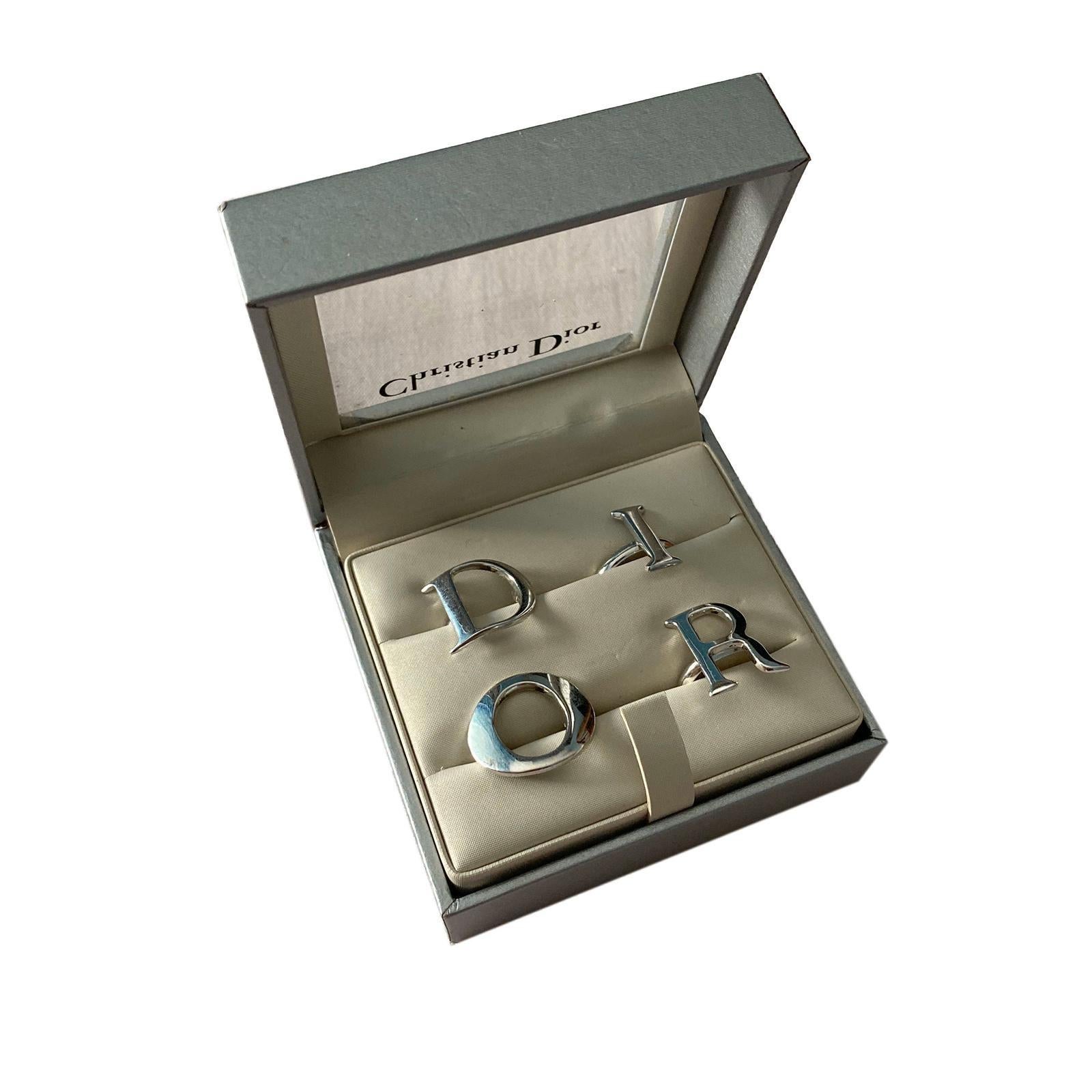 Vintage Christian Dior by Galliano Early 2000s Four Rings Spell-out Logo Set. Same model seen on the Dior Beauty Spring 2001 ad. 
 
Comes with original box.

One size, adjustable closing sistem (can fit any size).