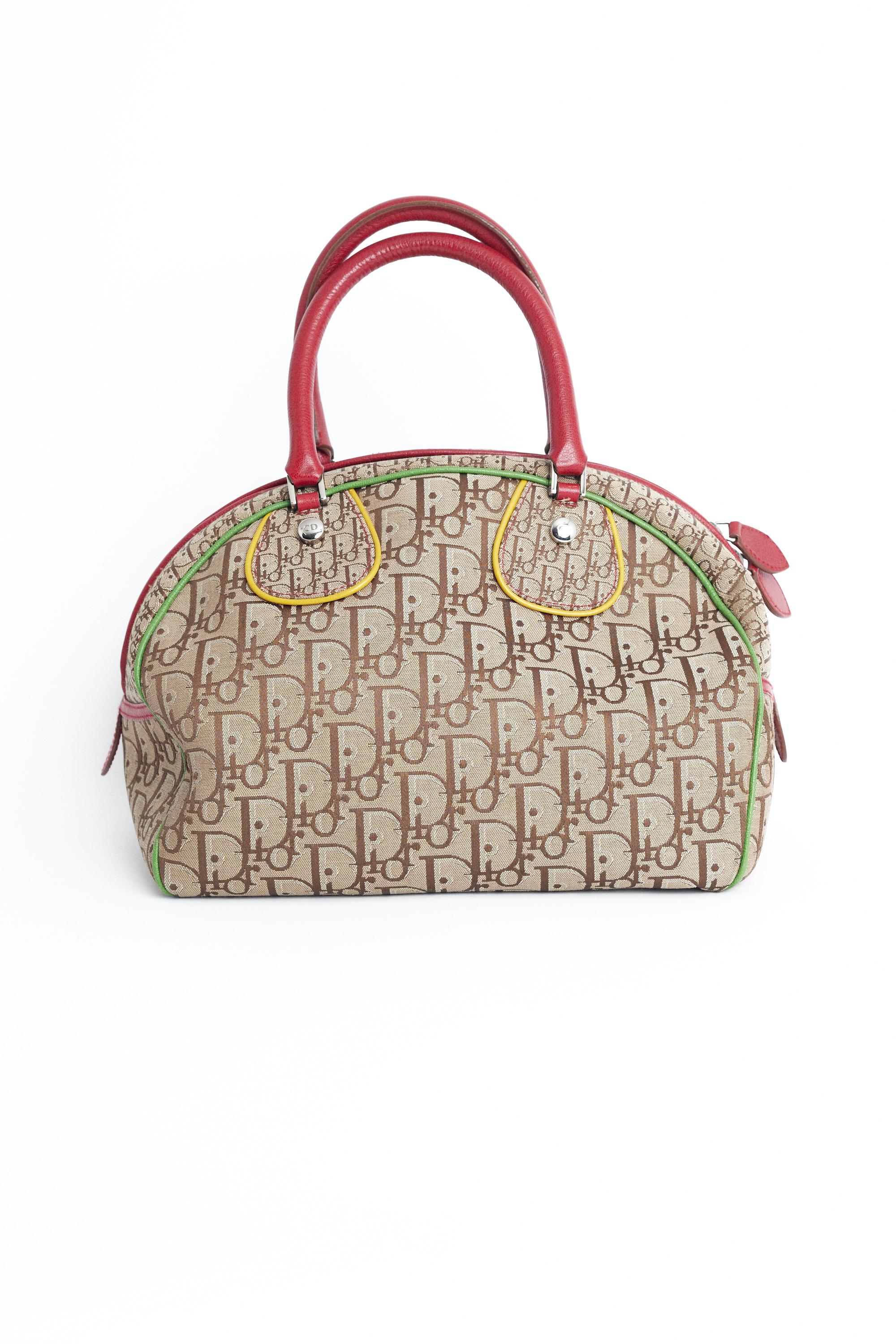 Christian Dior 2004 iconic Rasta collection bowling bag. Features all over monogram print, double zip closure and interior zipped pocket. Pre-loved, in excellent vintage condition.
Brand: Christian Dior
Color: Multi
2004
Bowling bag
Fabric: Canvas,
