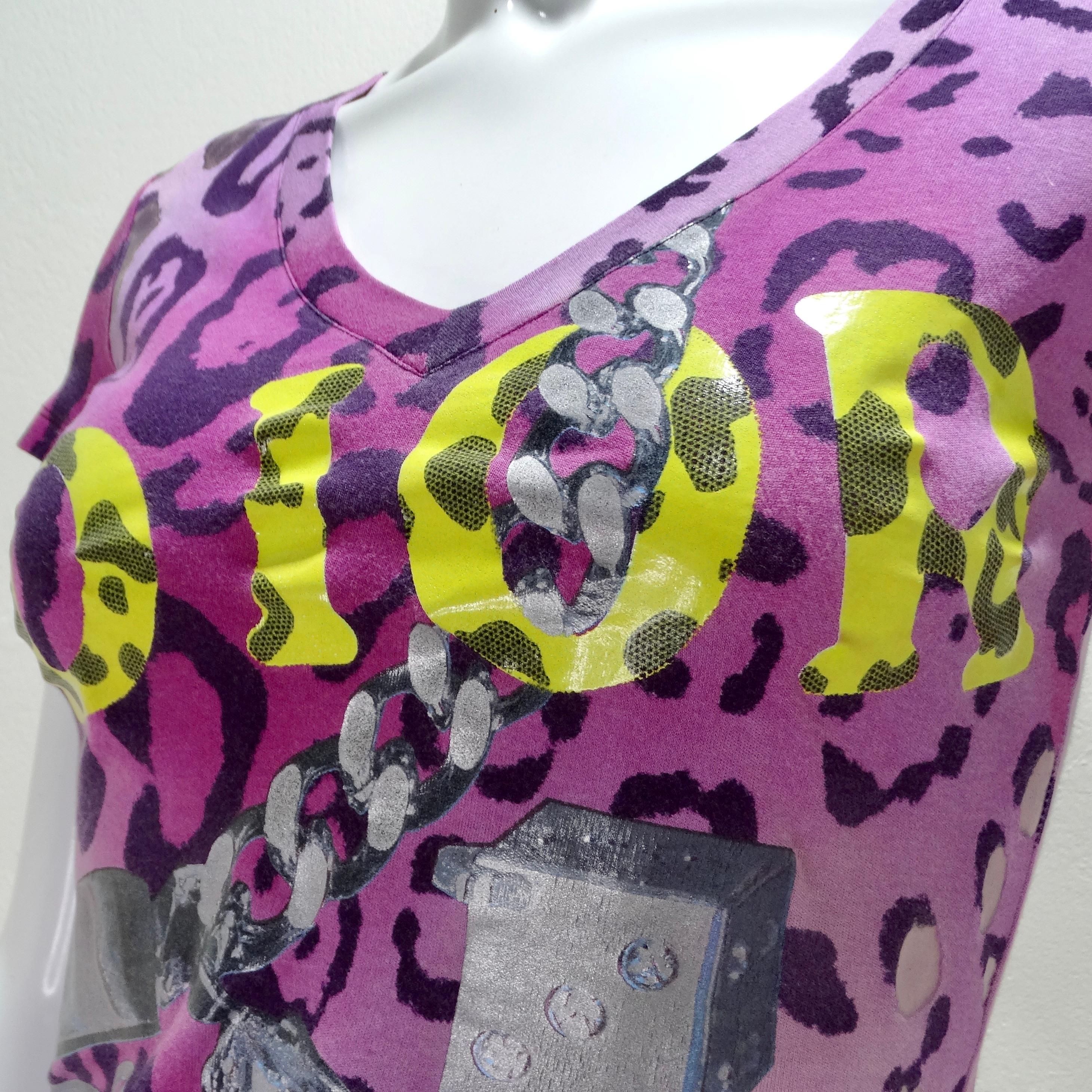 Make a bold statement with the Christian Dior 2004 Y2K Dice Leopard Print T-Shirt, a vibrant homage to the iconic John Galliano era for Christian Dior.

This eye-catching V-neck t-shirt features a striking purple leopard print that exudes boldness