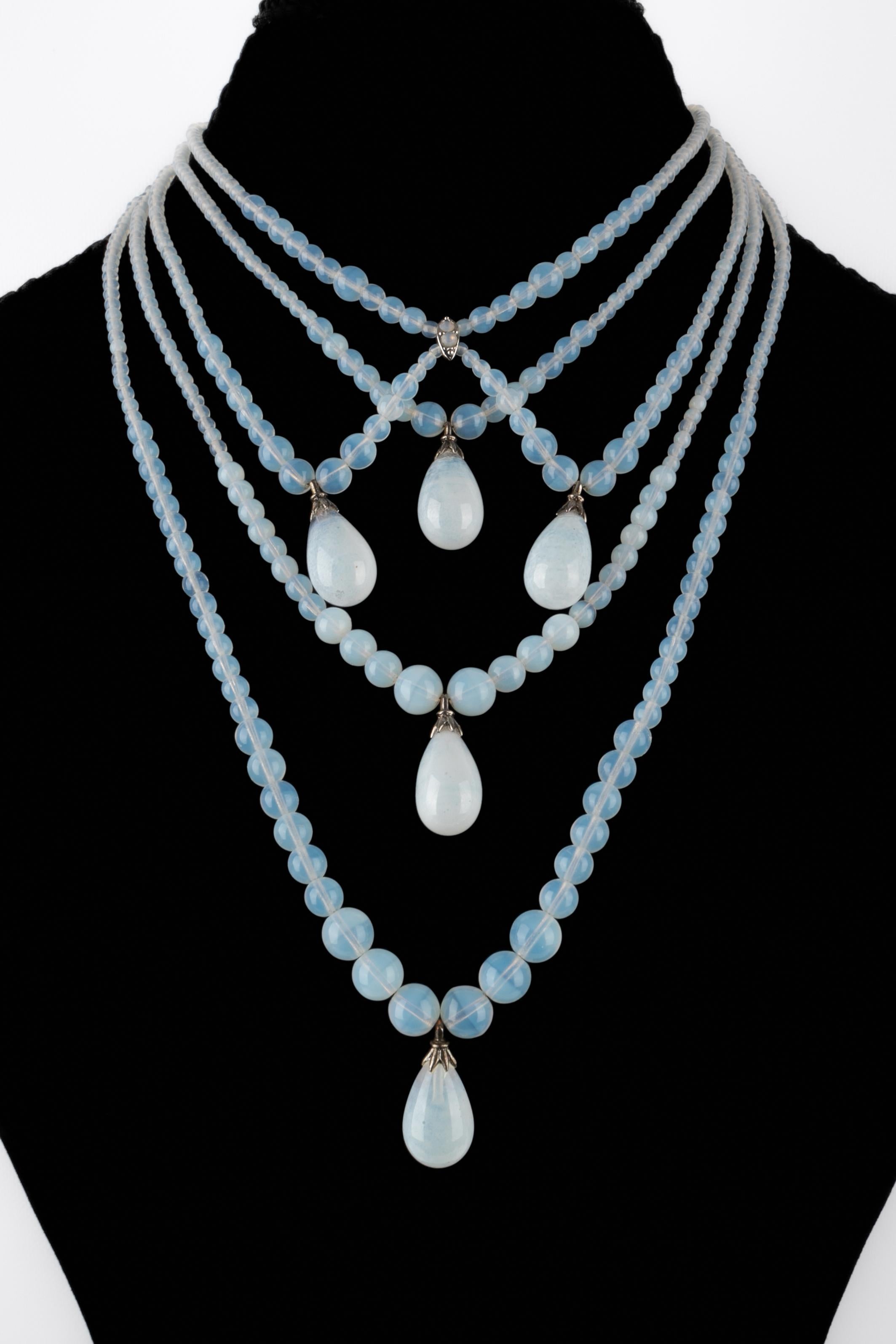 DIOR - (Made in France) Necklace composed of several rows of glass paste beads, holding glass paste drops. Collection circa 2003, under the artistic direction of John Galliano.

Condition :
Very good condition

Dimensions :
Length : from 38 cm to 41
