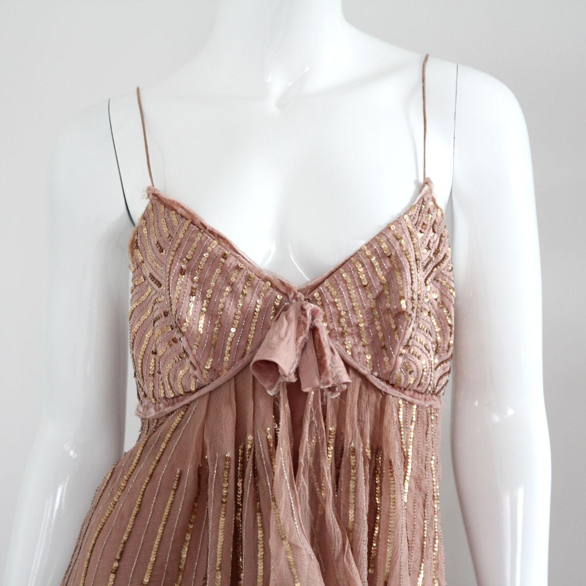 CHRISTIAN DIOR

2005. Old rose color dress with gold sequins from Christian Dior by John Galliano.

The elegant dress is an extremely rare collector's item.
Buy Now Or Cry Later! 

Get the incomparable Dior look of the Galliano era. 

The dress is