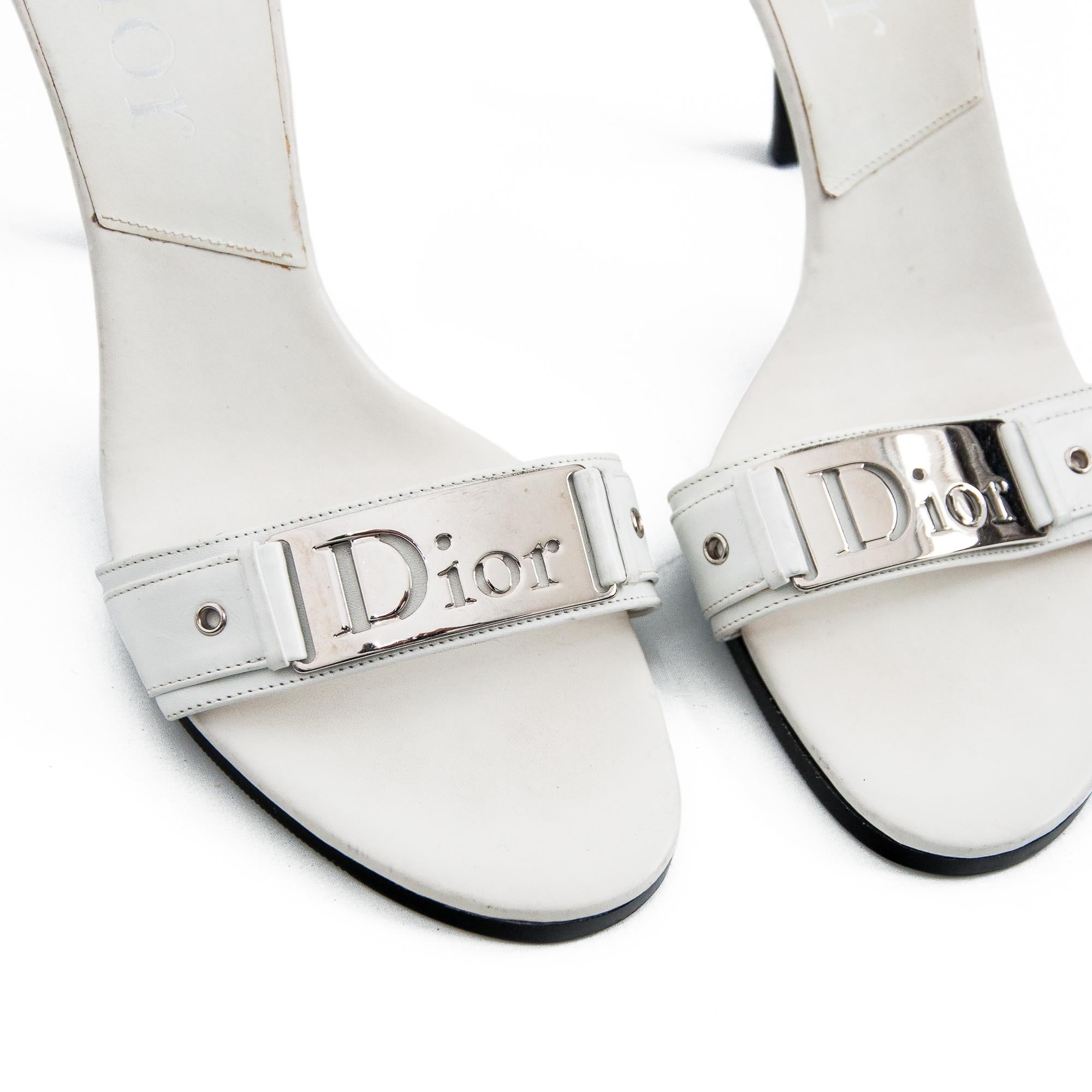 Ruder Than The Rest presents: vintage Christian Dior high heel mules by John Galliano or the spring-summer 2006 collection. 

White leather construction.

Chrome Dior nameplate on the strap.

Contrasting black sole and heel.

Vintage, 2006.

Made in