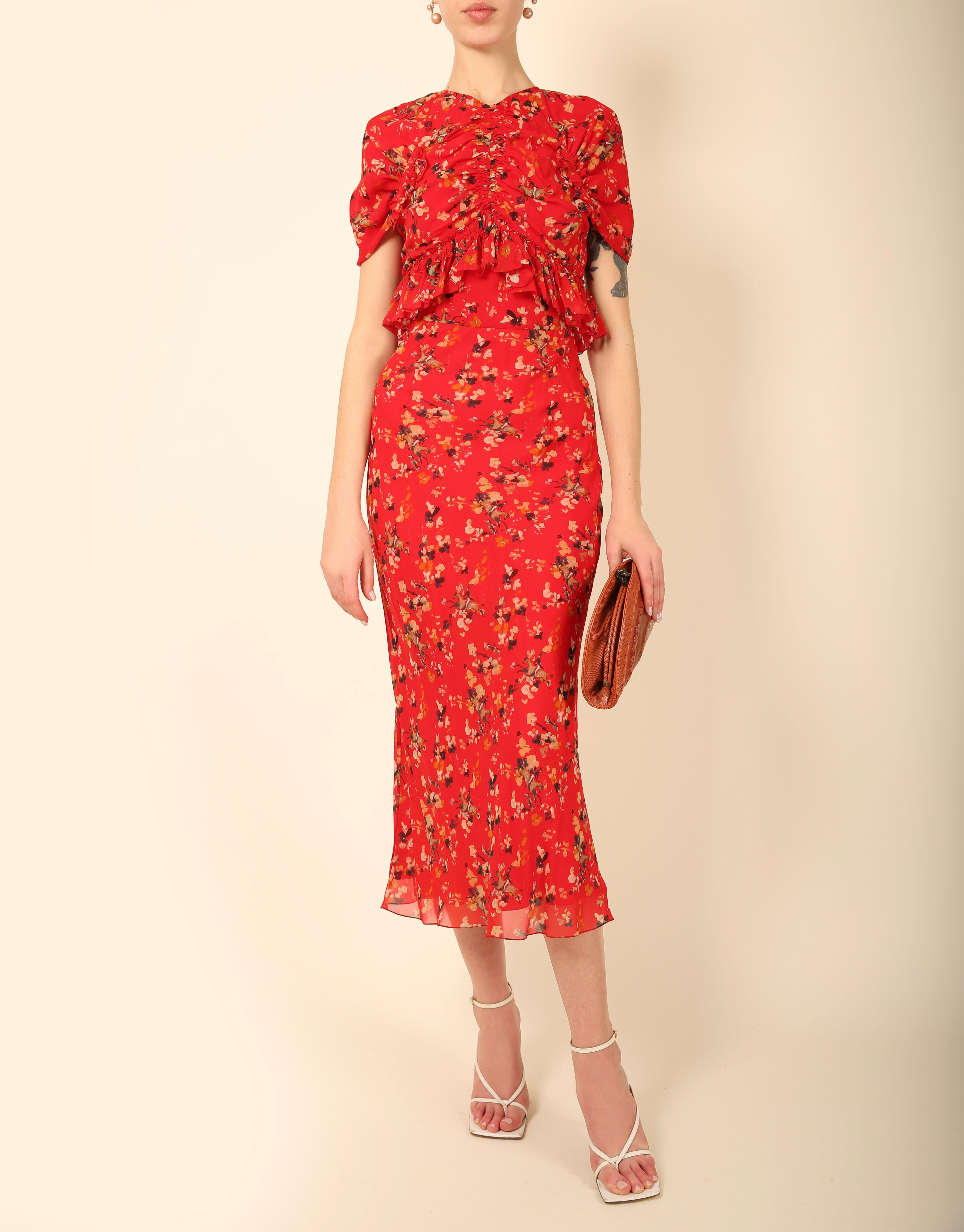 Christian Dior Look 9 from the Resort 2017 runway collection
Short sleeve red dress with floral print in yellow, white and blue
Fitted waist
Double layered skirt
Deep V back
Concealed back zip

Size:
FR 36

Composition:
100% Silk

In excellent
