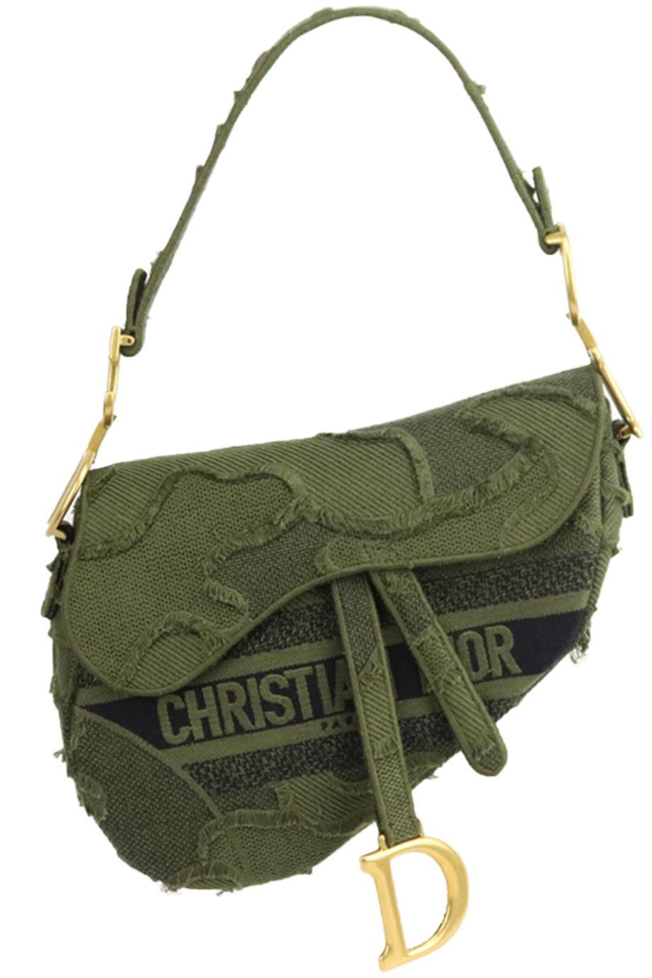 Made in Italy, this beautiful Christian Dior 2019 'Saddle' handbag has been made from green and black canvas exterior with matching interior, this piece is decorated with Dior's antiqued gold-tone hardware on the front and sides and logo across the