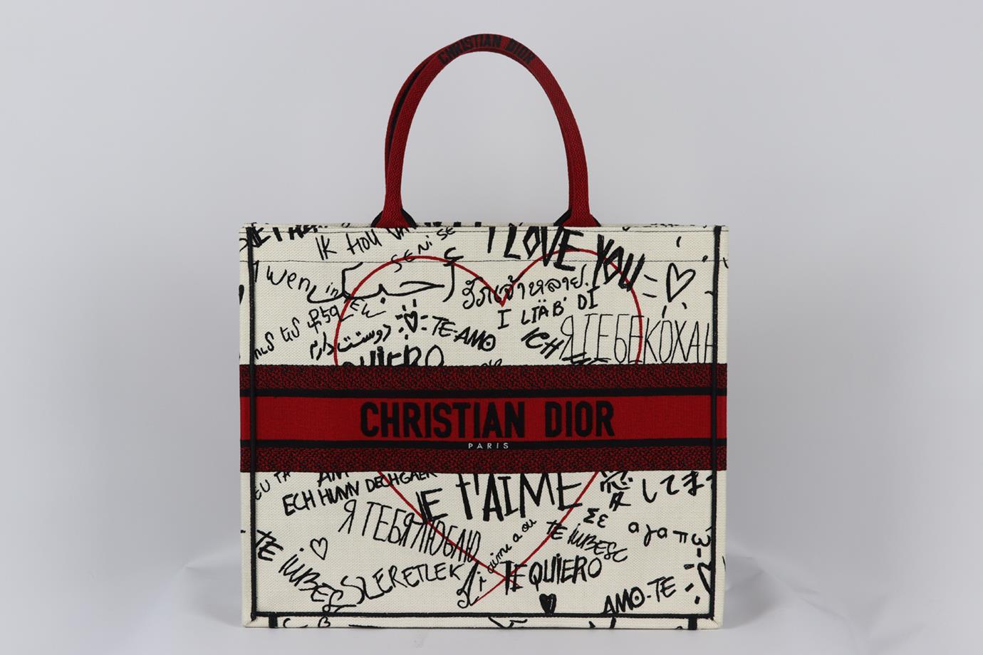Christian Dior 2020 Book large jacquard canvas tote bag. Made from white, red and black graffiti design with the brand's iconic logo on the front, it opens to a large internal compartment. Black, red and white. Open top. Does not come with dustbag