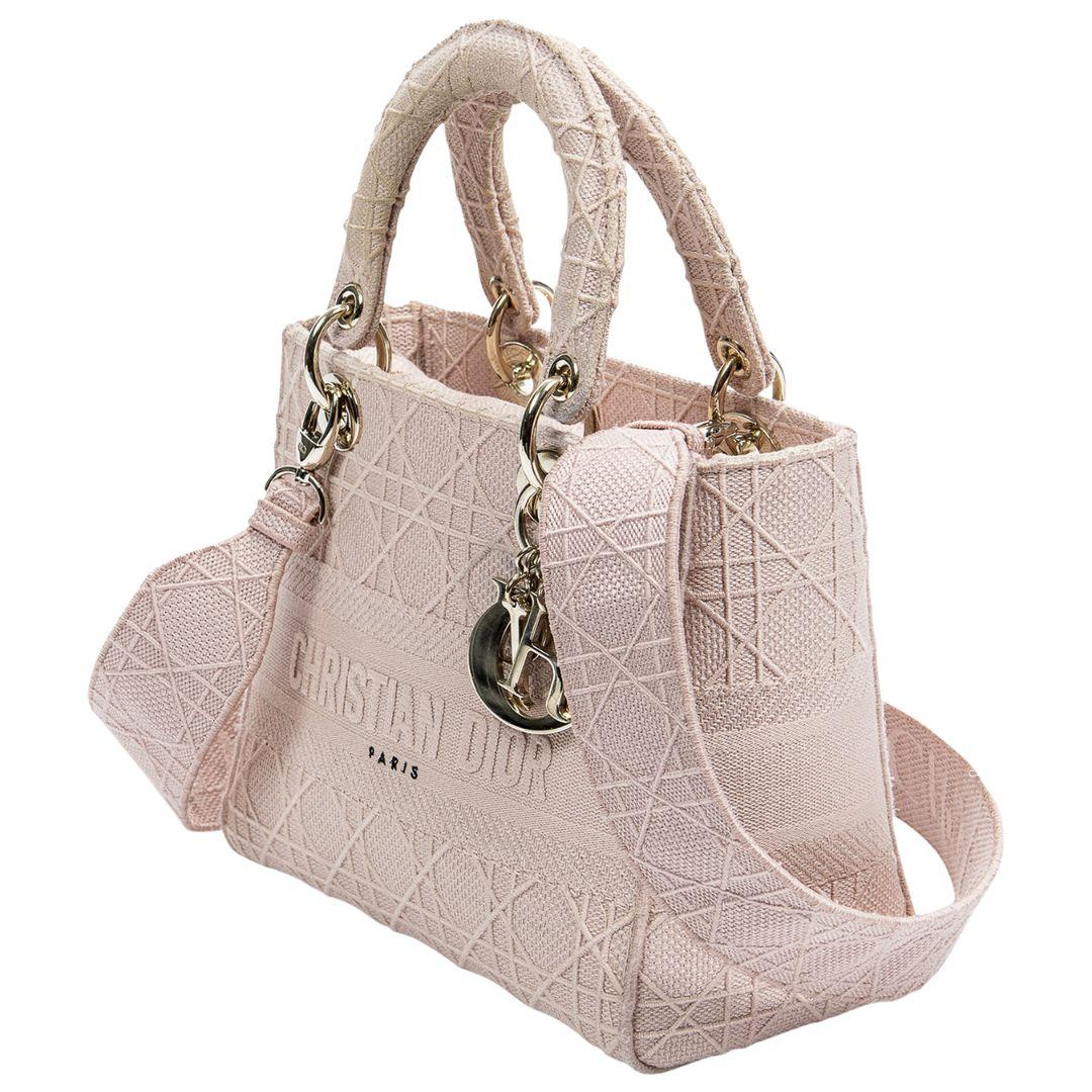 From the 2020 Collection, this beauty is crafted in gorgeous rose cannage embroidered canvas and is part of the Lady D-Lite collection. With Gold-Tone Hardware, Rolled Handles & Single Shoulder Strap, the Fold-In Flap Closure at top open up to a