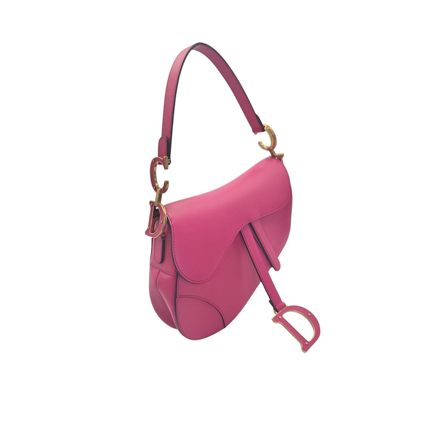 Indulge in luxurious style with the Christian Dior Vintage Ultra Matte Calfskin Saddle Bag. Crafted from premium fuchsia calfskin leather, this bag exudes elegance with its saddlebag shape and prominent Dior 