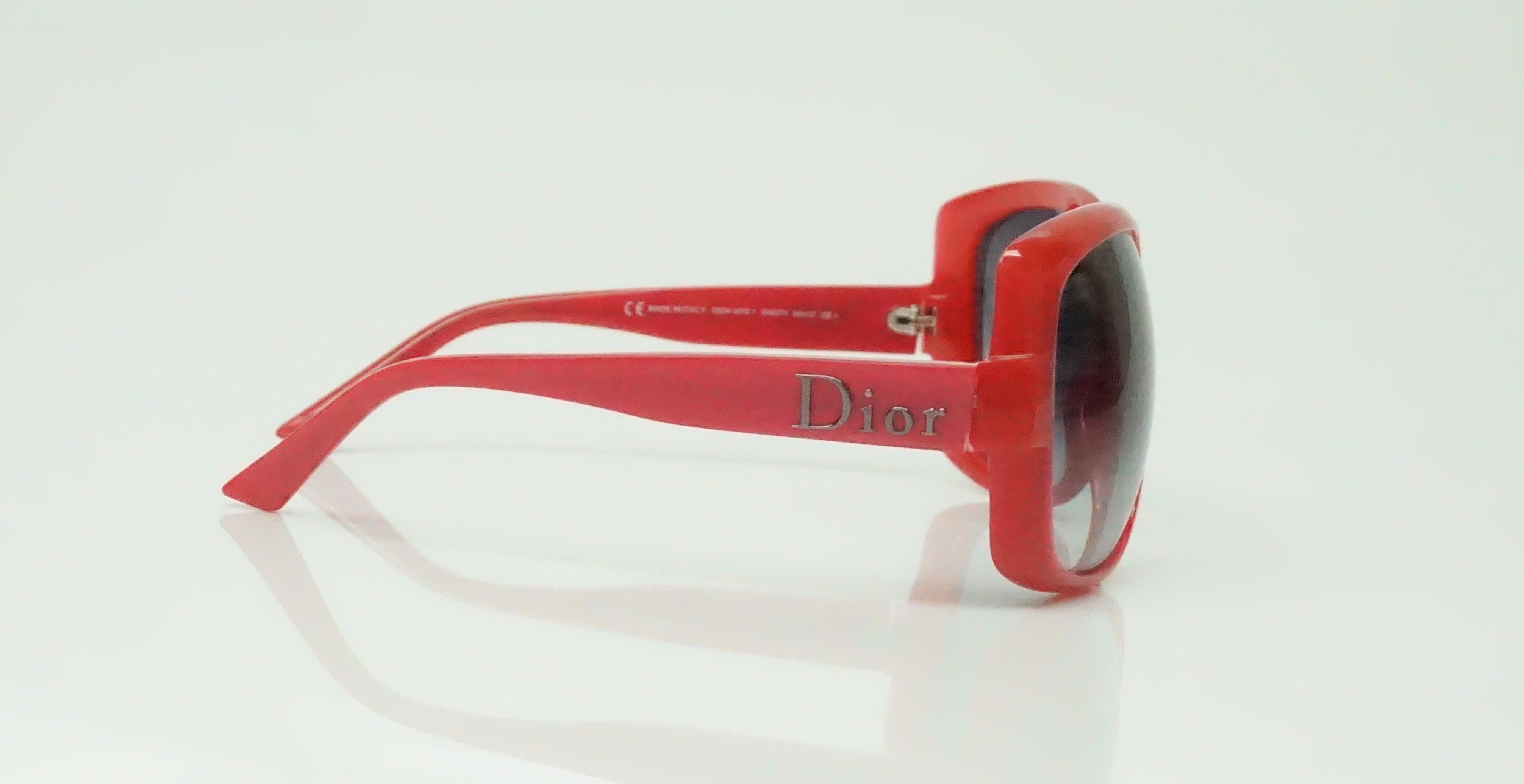 These Christian Dior 60's Logo sunglasses are in wonderful condition. They seem to have never been worn. The color is a bright red with a pinkish tone and opaque lens. 