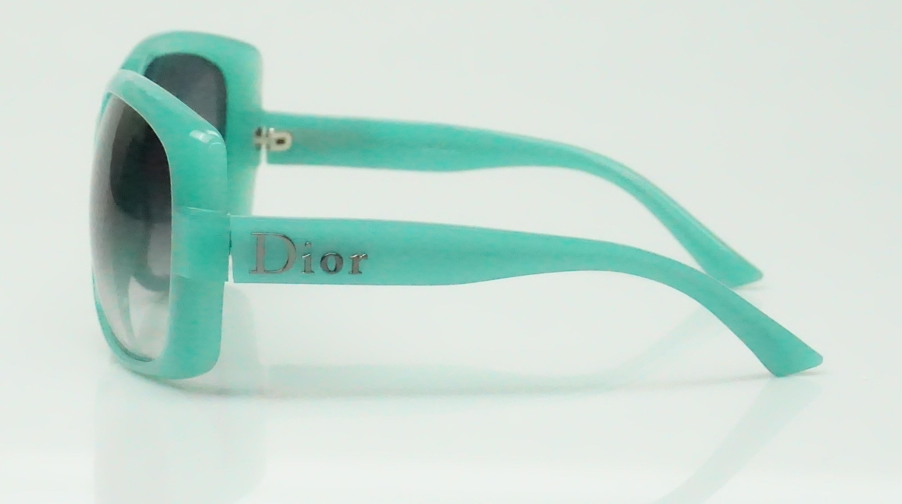 Christian Dior 60's Logo Turquoise Sunglasses- These fun sunglasses are in excellent condition. They are turquoise with opaque lens and silver Logo on legs.
Front: 6