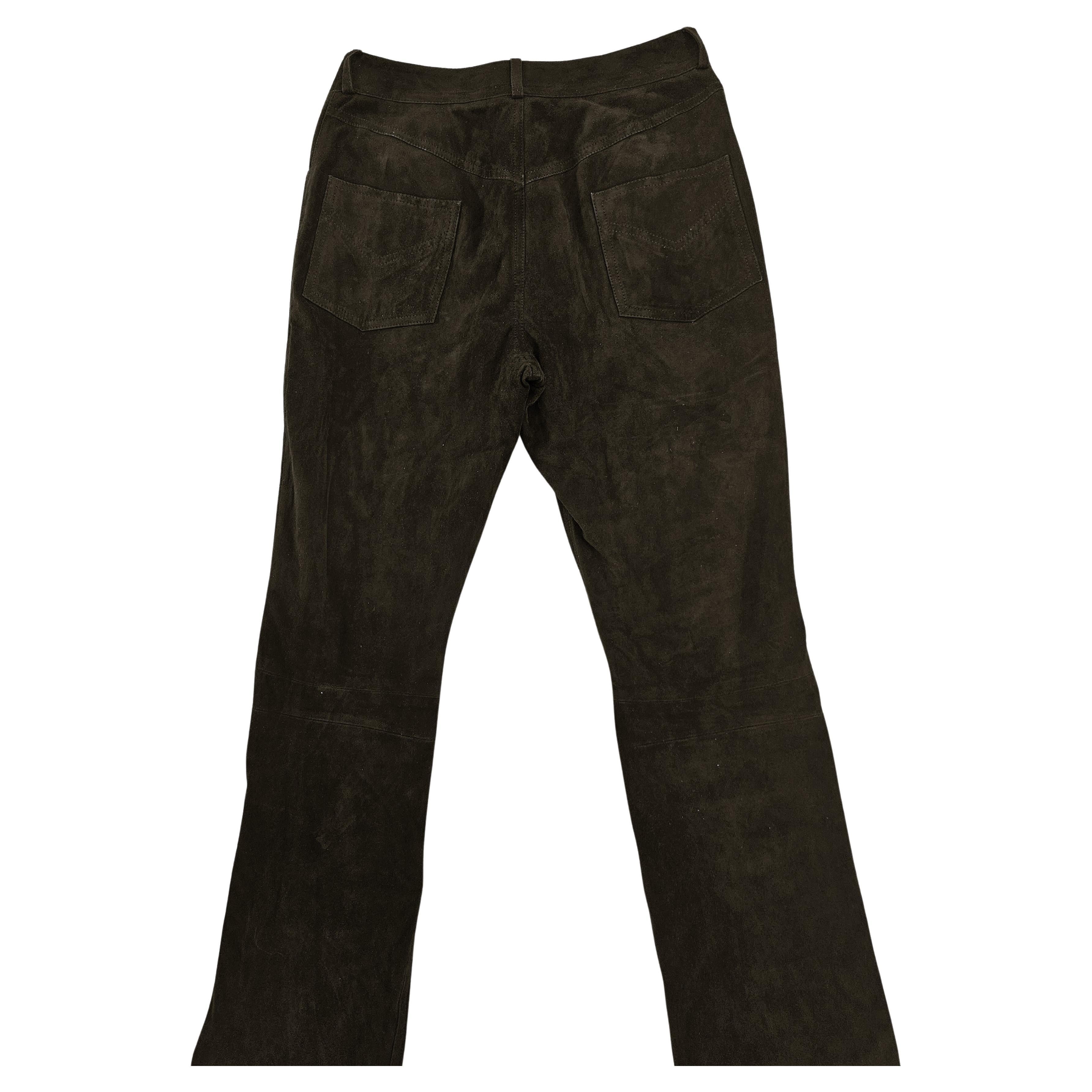 Christian Dior's dark brown suede (velvet goat) women's trousers from the late 1990s are a rare and elegant vintage piece that combines craftsmanship, timeless style, and the aesthetic of the Dior house. These trousers are made from high-quality