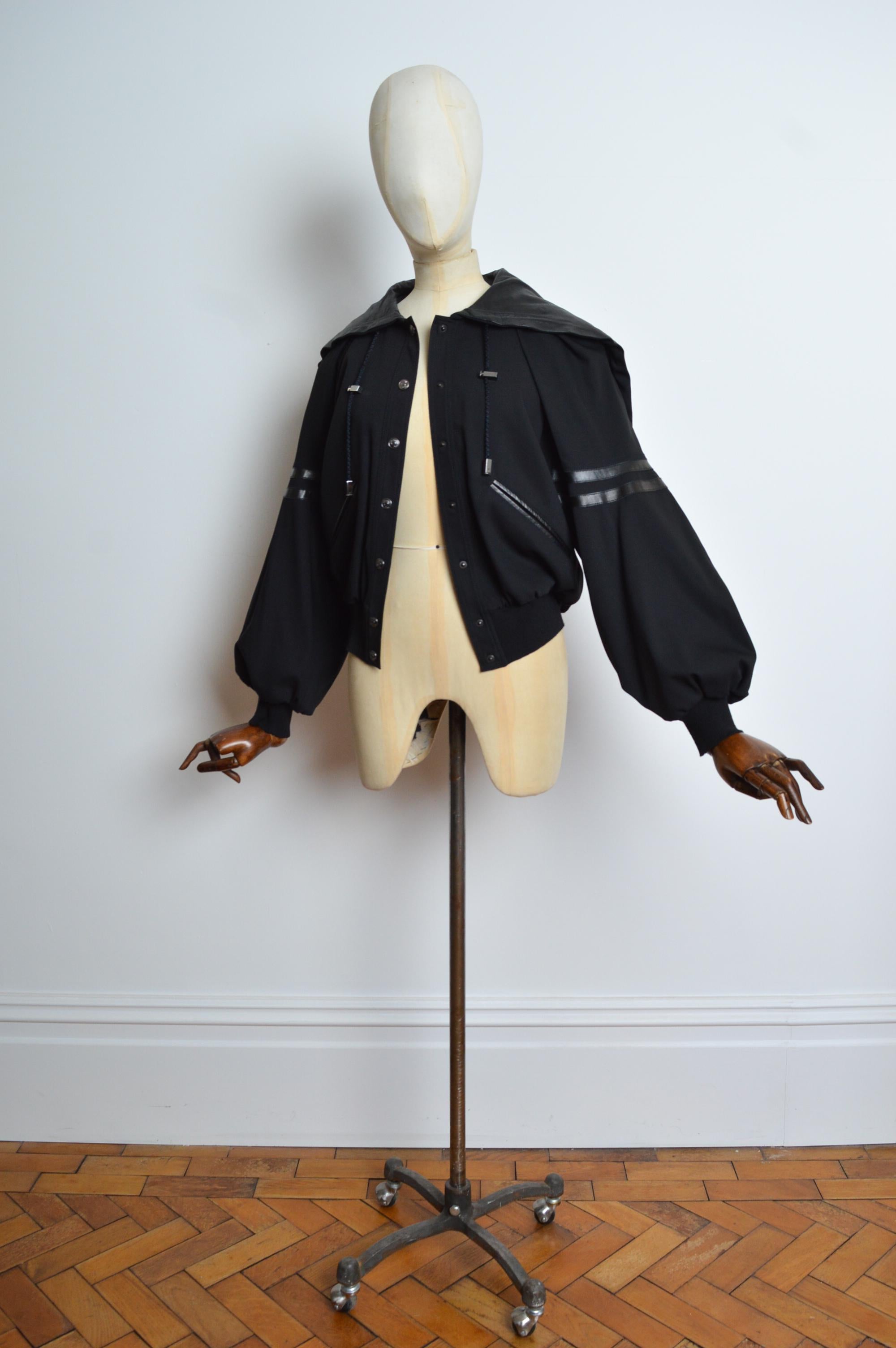 Superb Autumn / Winter 2002 ‘J’ADORE’ Varsity jacket by John GALLIANO for CHRISTIAN DIOR. 
Crafted from a Black wool cloth and butter soft lamb skin leather featuring a slightly cropped silhouette, Bellowing racer striped sleeves and Fun zip open