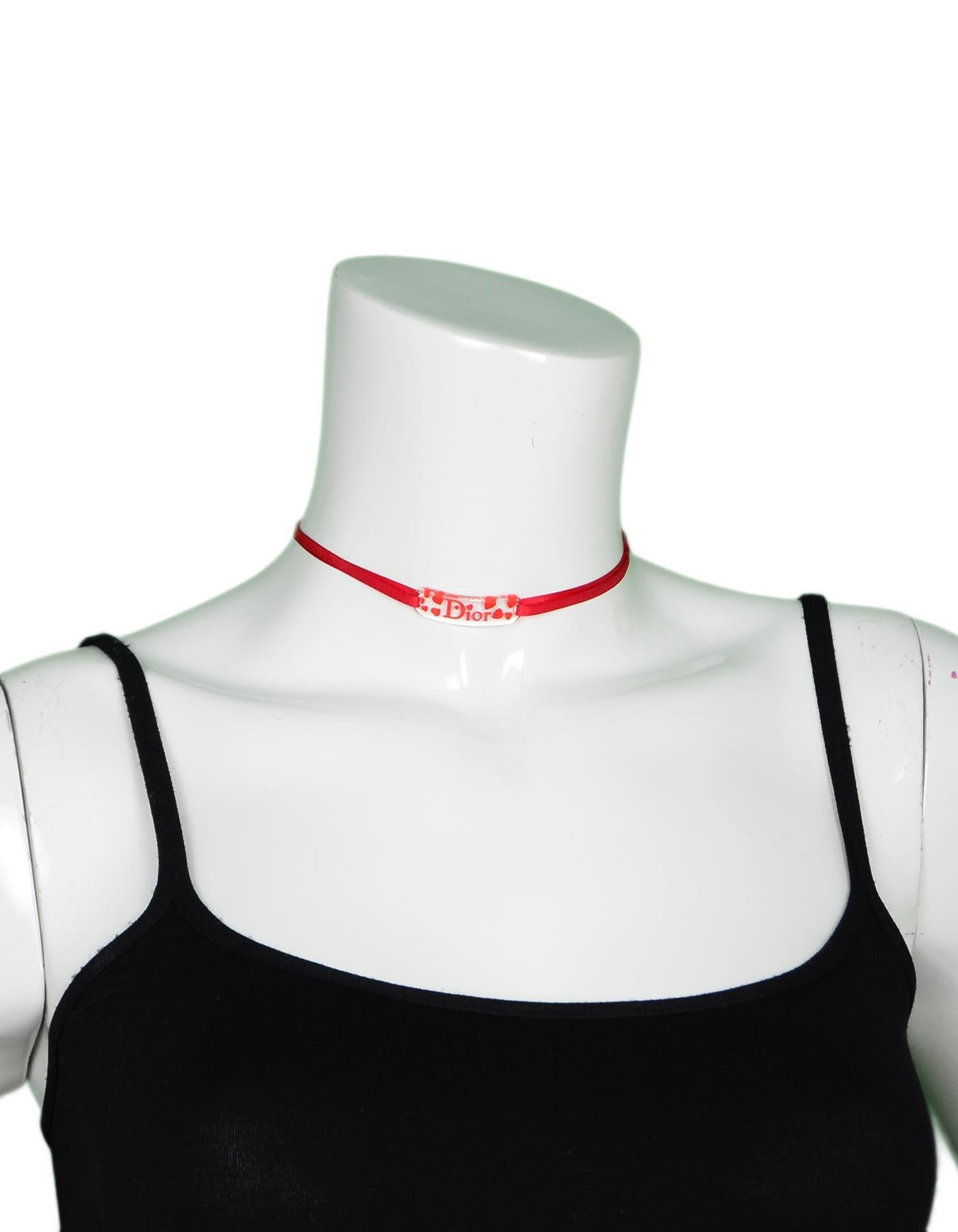 Christian Dior Acrylic Logo Heart Red Ribbon Choker Necklace 

Color: Red, clear
Materials: Ribbon and acrylic 
Hallmarks: 