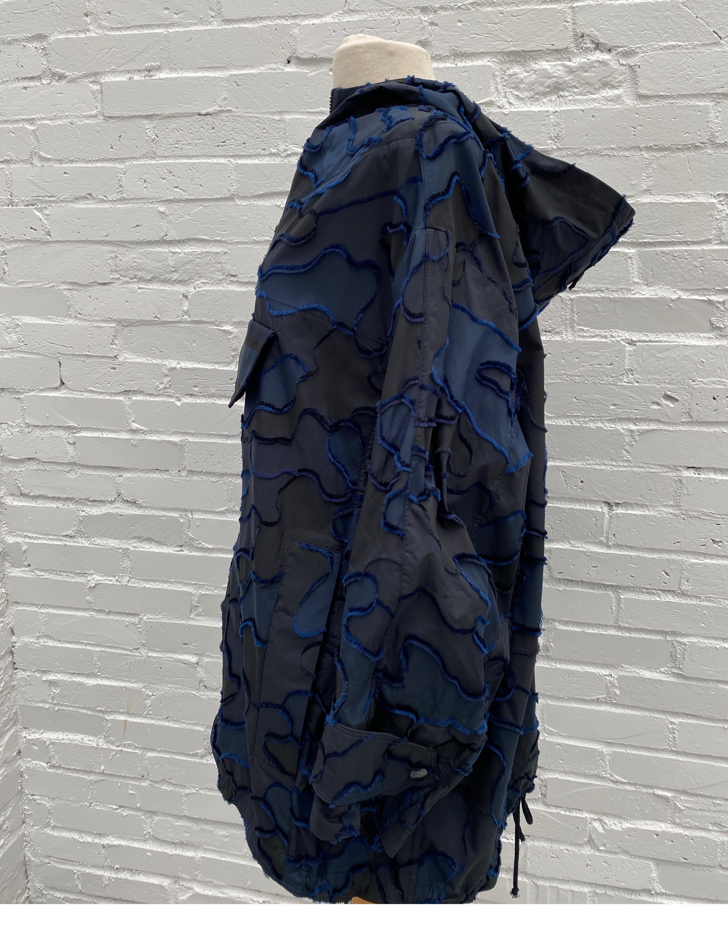 Christian Dior Anorak Navy Windbreaker. XS size is oversized. Fits size 2-8. Great looking light jacket with Logo. Sold out at Dior. Rare and limited. Retail $3600 plus tax. Brand new condition. Guaranteed authentic. 