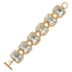 Bracciale articolato Christian Dior in metallo dorato e strass