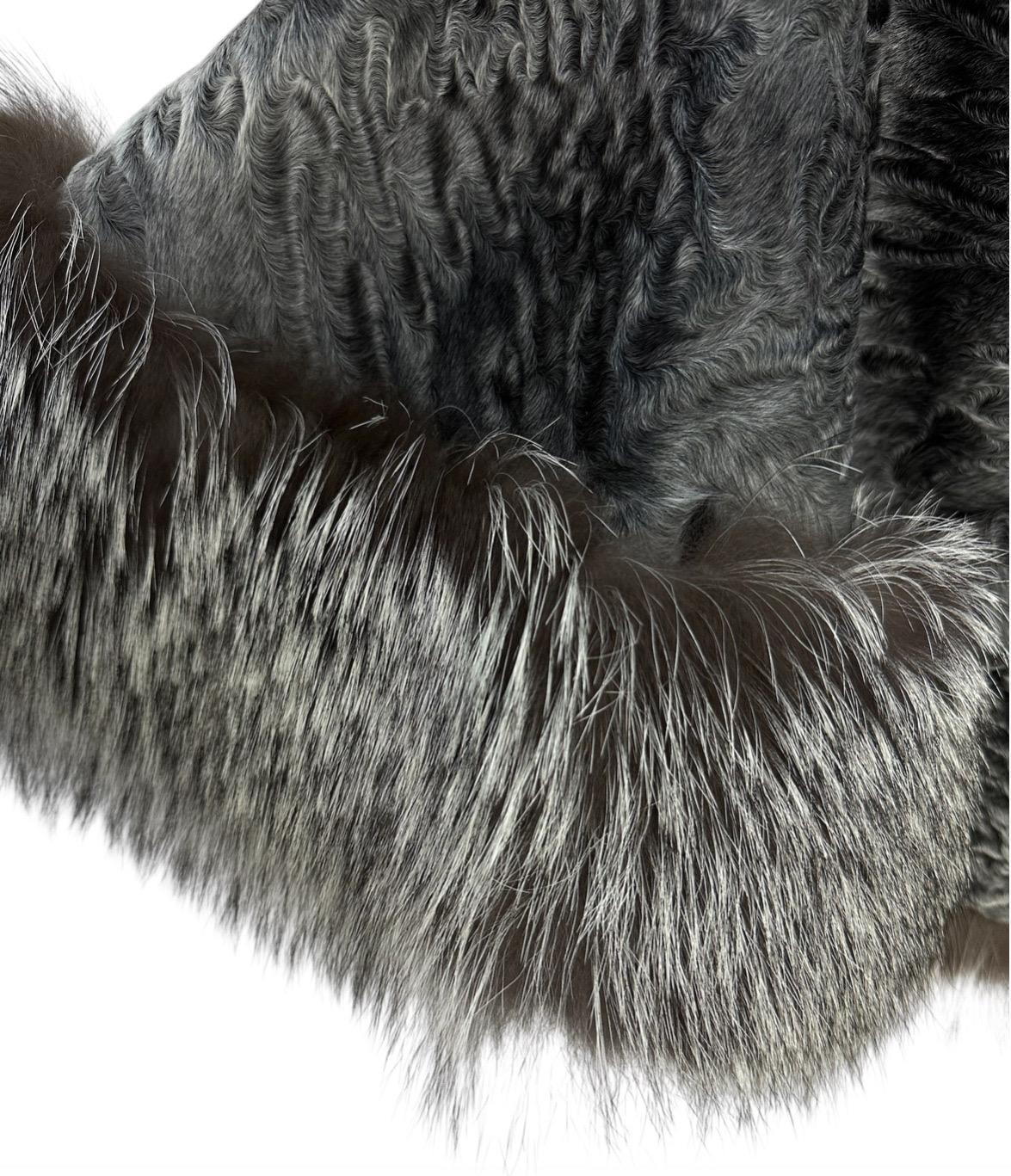 Elevate your winter wardrobe with this luxurious Christian Dior Astrakhan coat. 

Crafted from soft lambskin, the coat features a distinctive texture and a cropped silhouette, offering a modern twist on a classic design. The voluminous fox fur