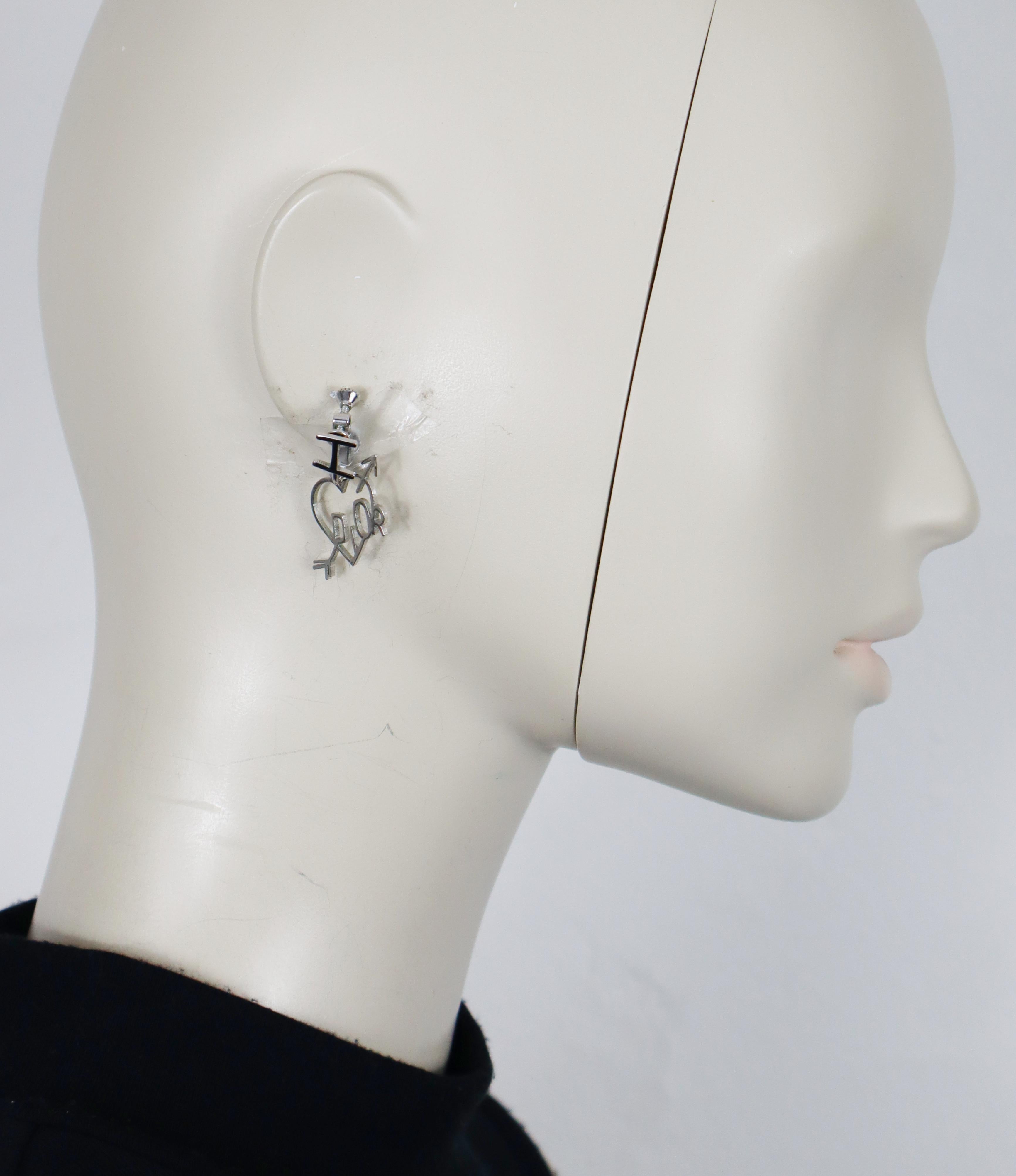 CHRISTIAN DIOR (attributed to) vintage silver tone I LOVE DIOR dangle earrings (clip-on with screw system).

Unsigned (usual for this model).

Indicative measurements : height approx. 3.2 cm (1.26 inches) / max width approx. 1.9 cm (0.75