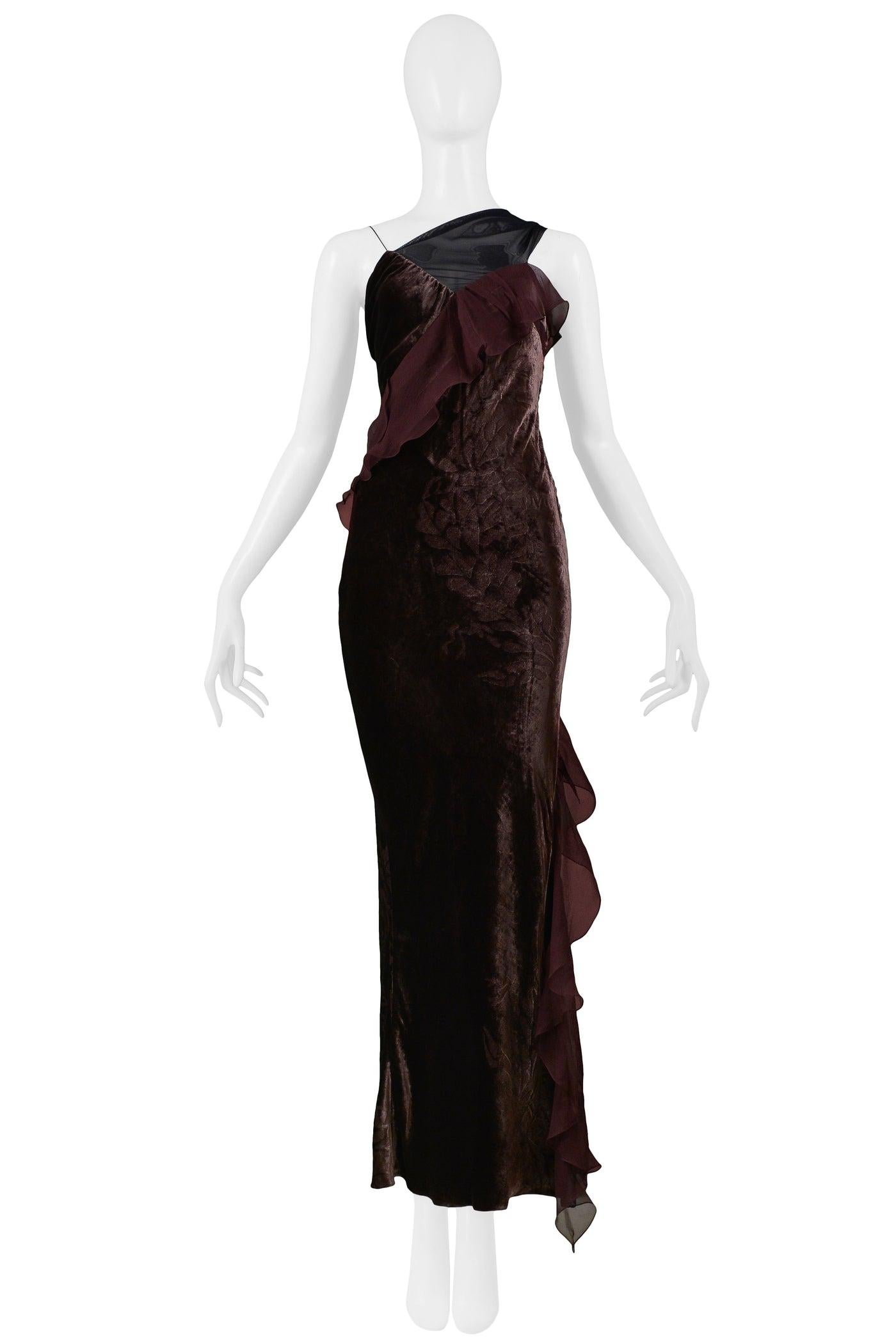 Resurrection is excited to offer this vintage Christian Dior aubergine purple floral devoré velvet gown with chiffon ruffle detail, spaghetti straps, asymmetrical sheer mesh panel at chest, and side button closure.

Christian Dior Paris
Designed by