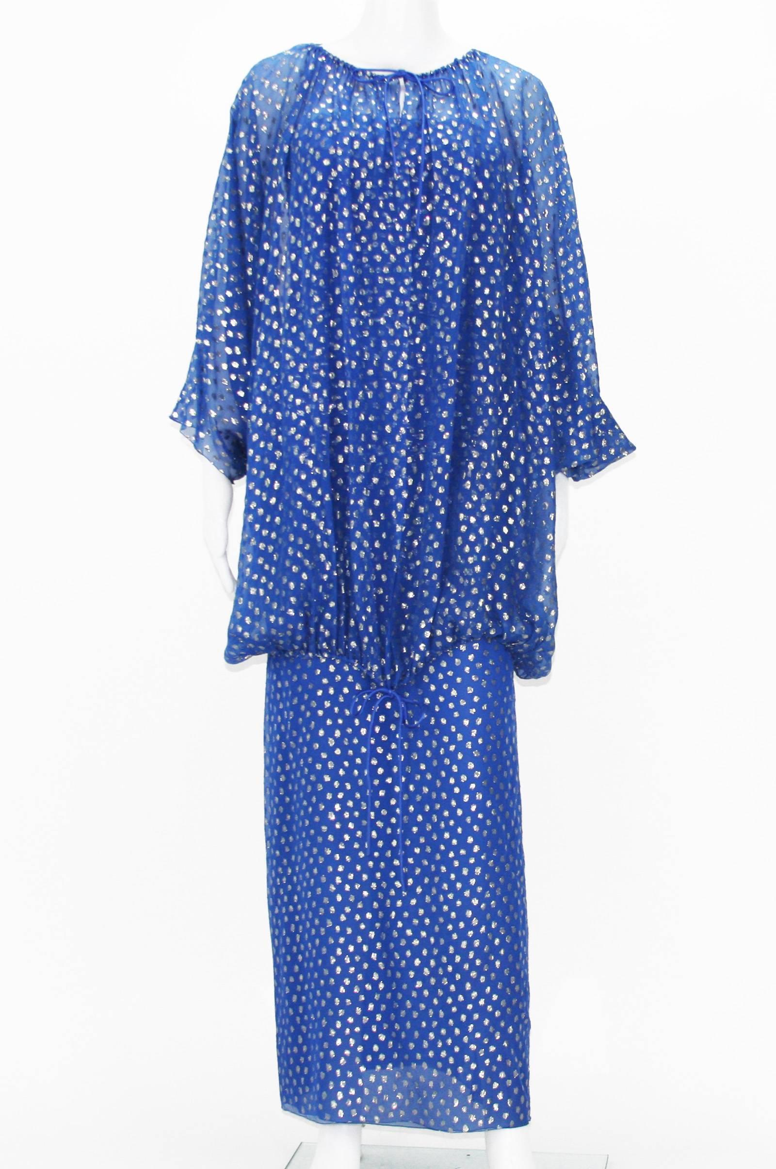 Christian Dior Paris
Automne-Hiver 1976, Numbered - 8194
Polka Dot Blue Sheer with Metallic Silver Dots Dress Set.
Dress - Strapless, Draped, Side Slit, Fully Lined, Elastic Band at Bust, Side Zip Closure.
Measurements: Length - 49 inches, Bust -