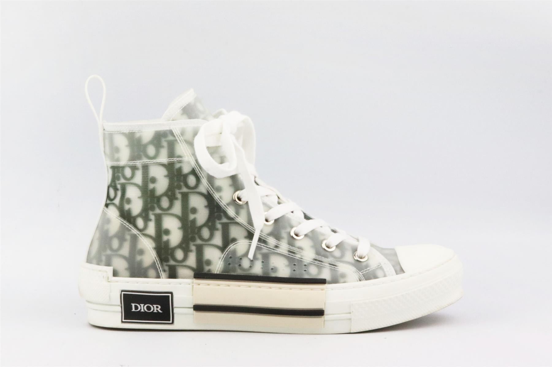 These ‘B23’ sneakers by Christian Dior have been made in Italy from black and white oblique logo canvas in a high-top silhouette, it’s finished with the brand’s iconic logo on the rubber soles. Rubber sole measures approximately 38 mm/ 1.5 inches.