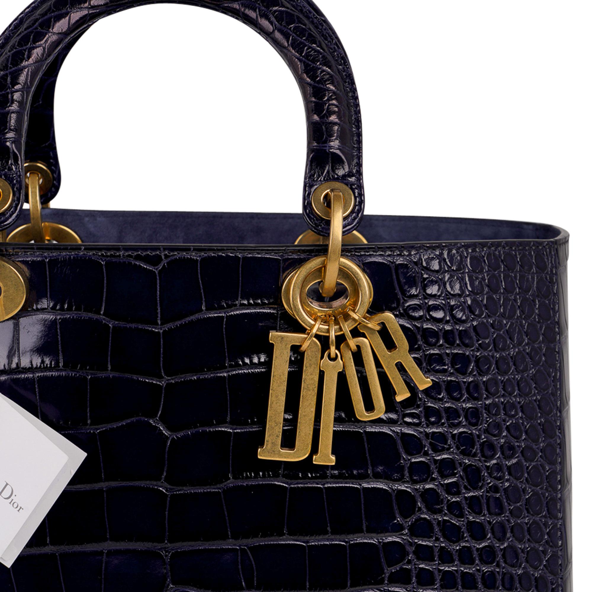 Mightychic offers a Christian Dior Lady Dior Bag featured in rich Navy matte Alligator.
Logo charms are matte brass hardware.
Top flap.
Interior is lined in Blue Suede.
One zip pocket and one slot pocket inside.
Interior exotic leather logo