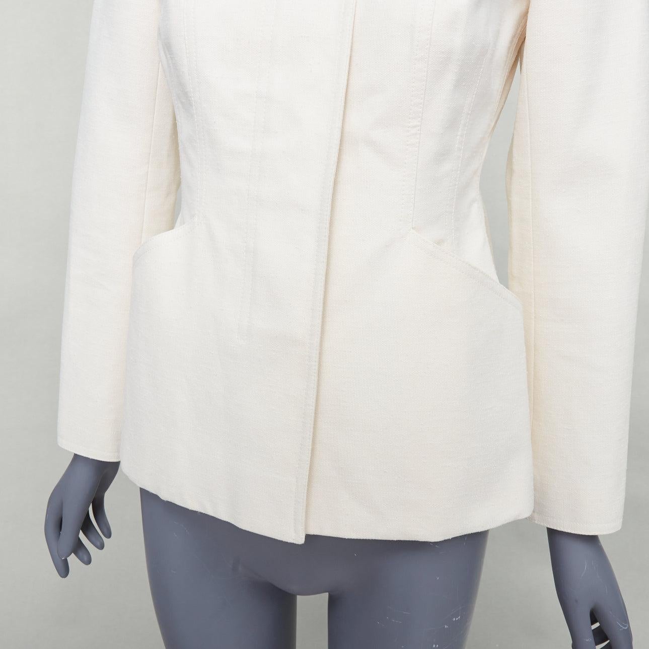 CHRISTIAN DIOR Bar Jacket cream cotton blend canvas contour jacket FR36 S
Reference: JACG/A00178
Brand: Dior
Designer: Maria Grazia Chiuri
Model: Bar
Material: Cotton, Blend
Color: Cream, Black
Pattern: Solid
Closure: Button
Lining: Cream
