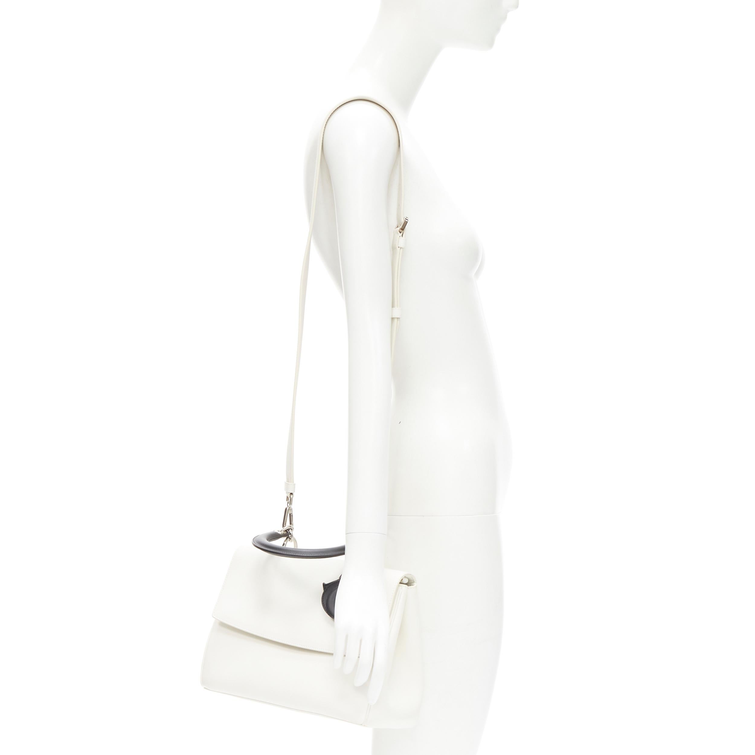 CHRISTIAN DIOR BE Dior black white leather logo charm flap satchel bag 
Reference: TGAS/C01269 
Brand: Christian Dior 
Model: Be Dior 
Material: Leather 
Color: White 
Pattern: Solid 
Closure: Magnet 
Extra Detail: White leather upper. Contrast