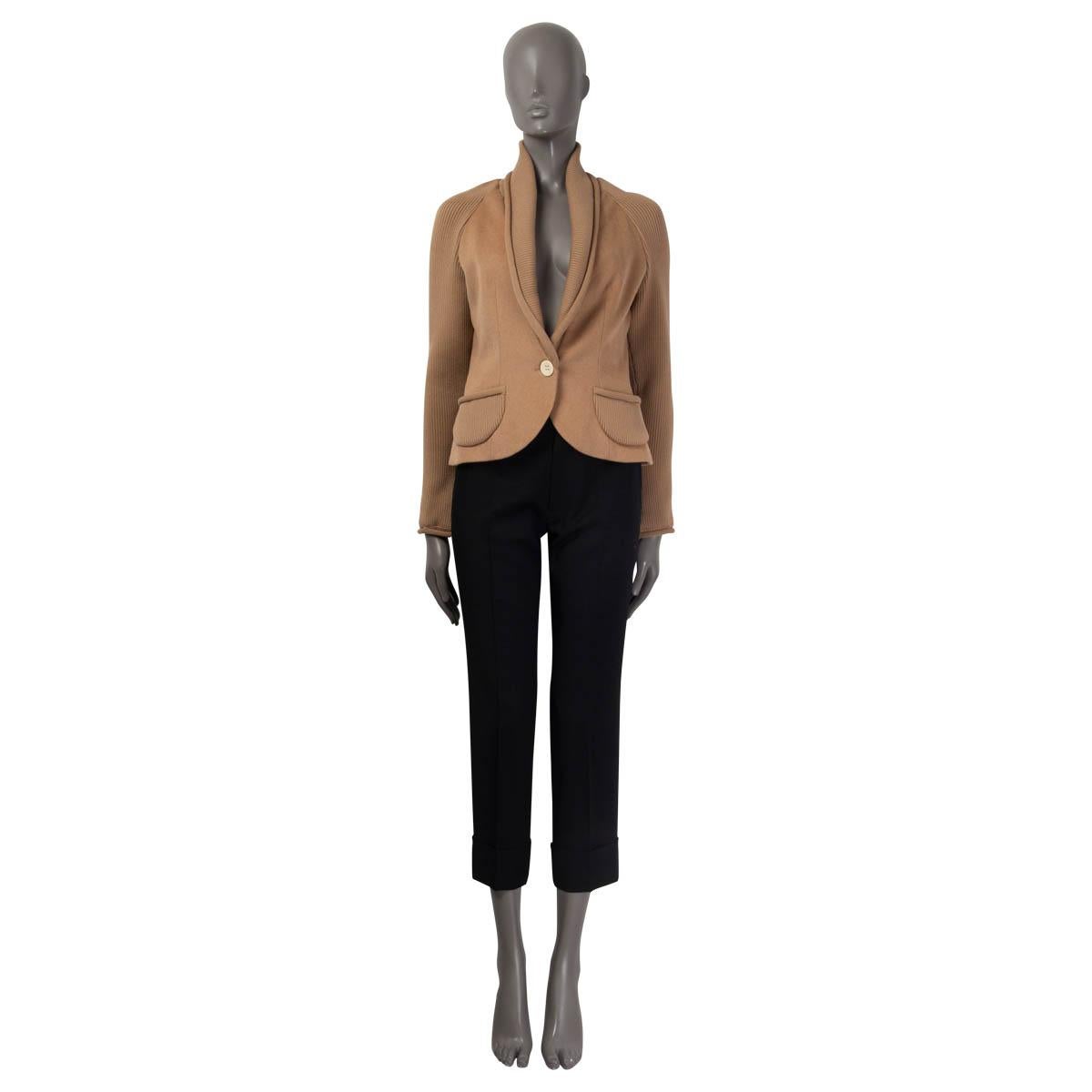 100% authentic Christian Dior one button blazer in beige camel (100%). Features a ribbed shawl collar, ribbed long raglan sleeves (sleeve measurements taken from the neck) and ribbed pockets on the front. Opens with a beige button on the front.