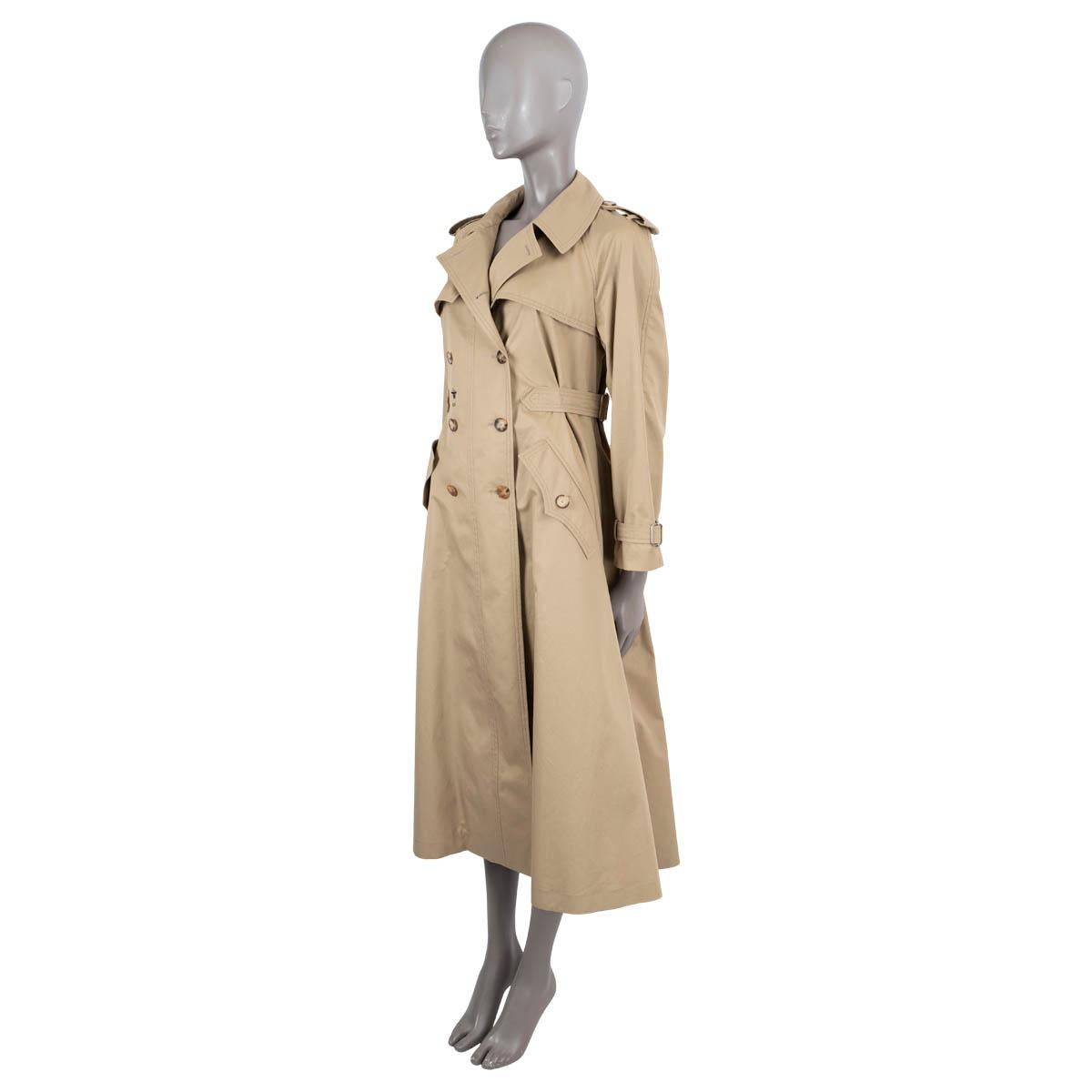 100% authentic Christian Dior classic trench coat in beige gaberdine cotton (100%). Features notch lapels, epaulettes, adjustable waist and cuff straps, storm flap and embroidered bee logo. Closes with double-breasted horn buttons on the front.