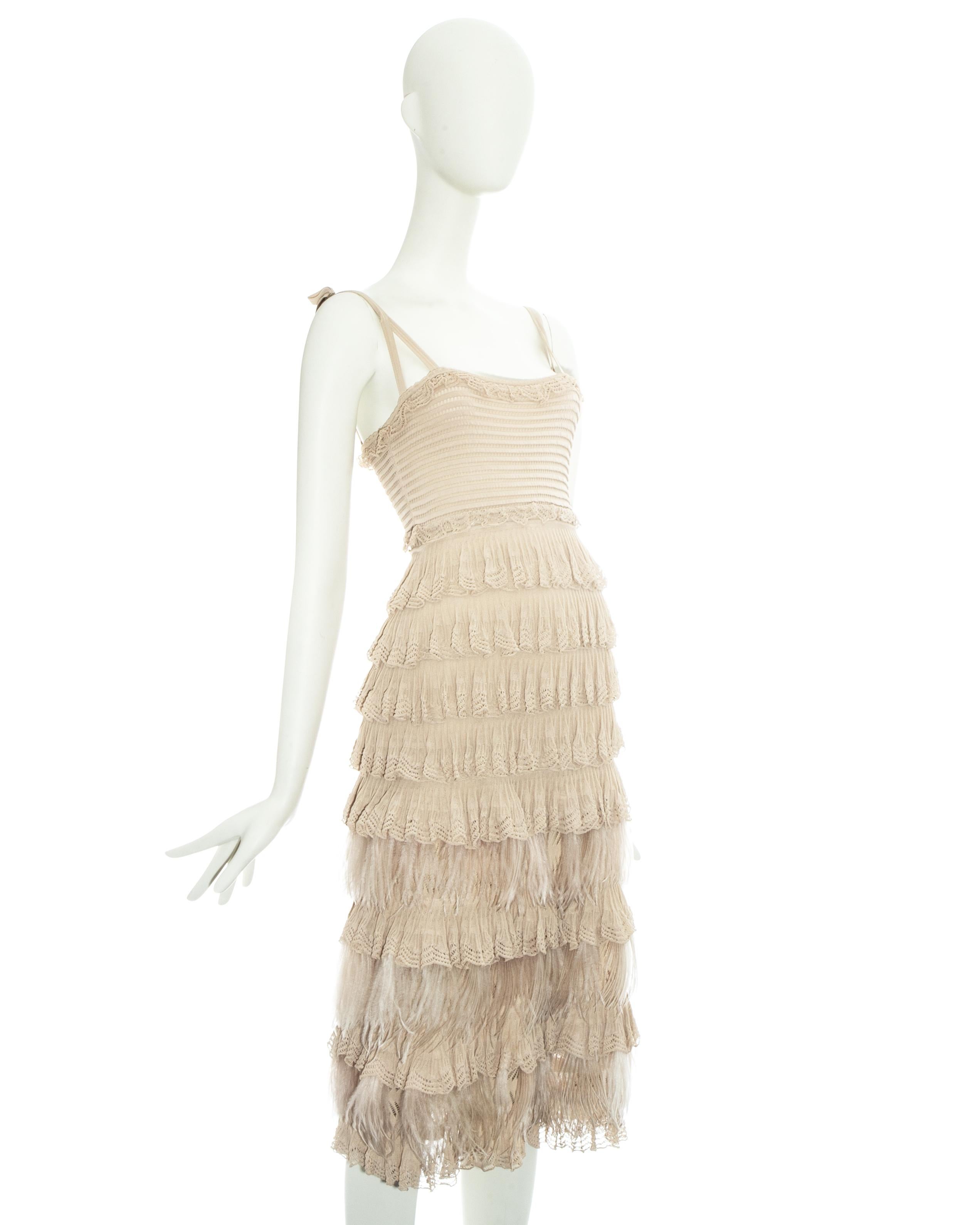 Christian Dior by John Galliano beige knitted dress with ruffled skirt and ostrich feathers

Fall-Winter 2011