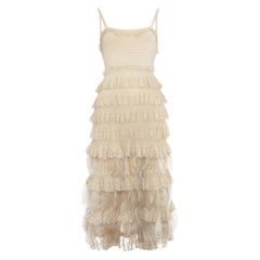 Used Christian Dior beige knitted ruffled dress with ostrich feathers, fw 2011