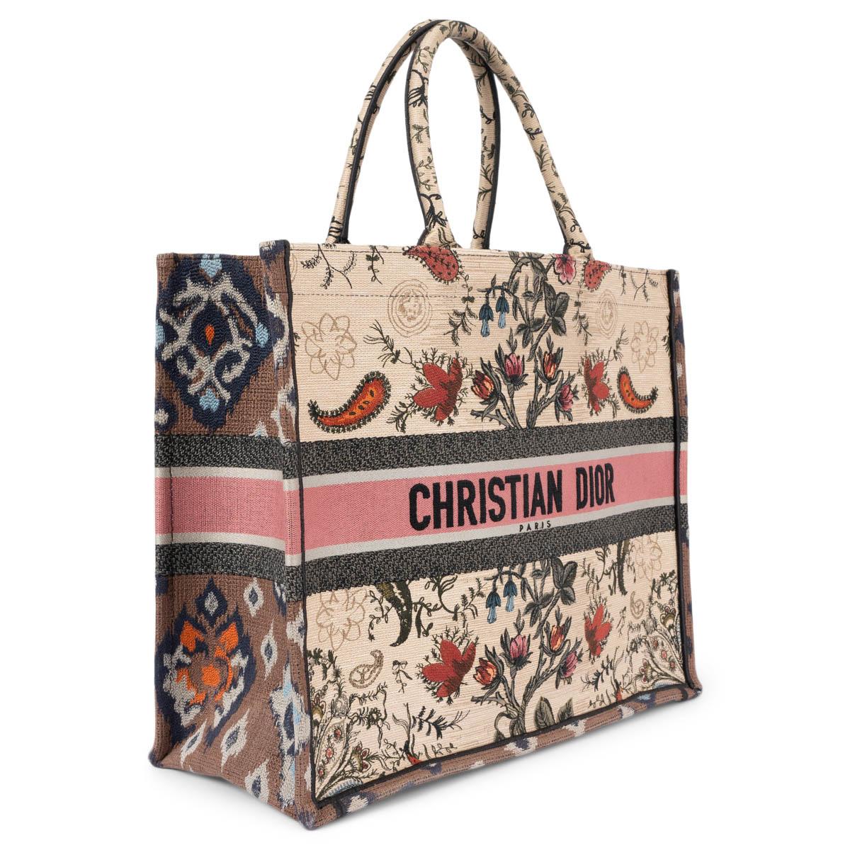 100% authentic Christian Dior Book Tote Large in beige, brown, pink and midnight blue floral embroidered canvas. Unlined. Has been carried and is in excellent condition. 

2021 Spring/Summer

Measurements
Height	34cm (13.3in)
Width	40cm
