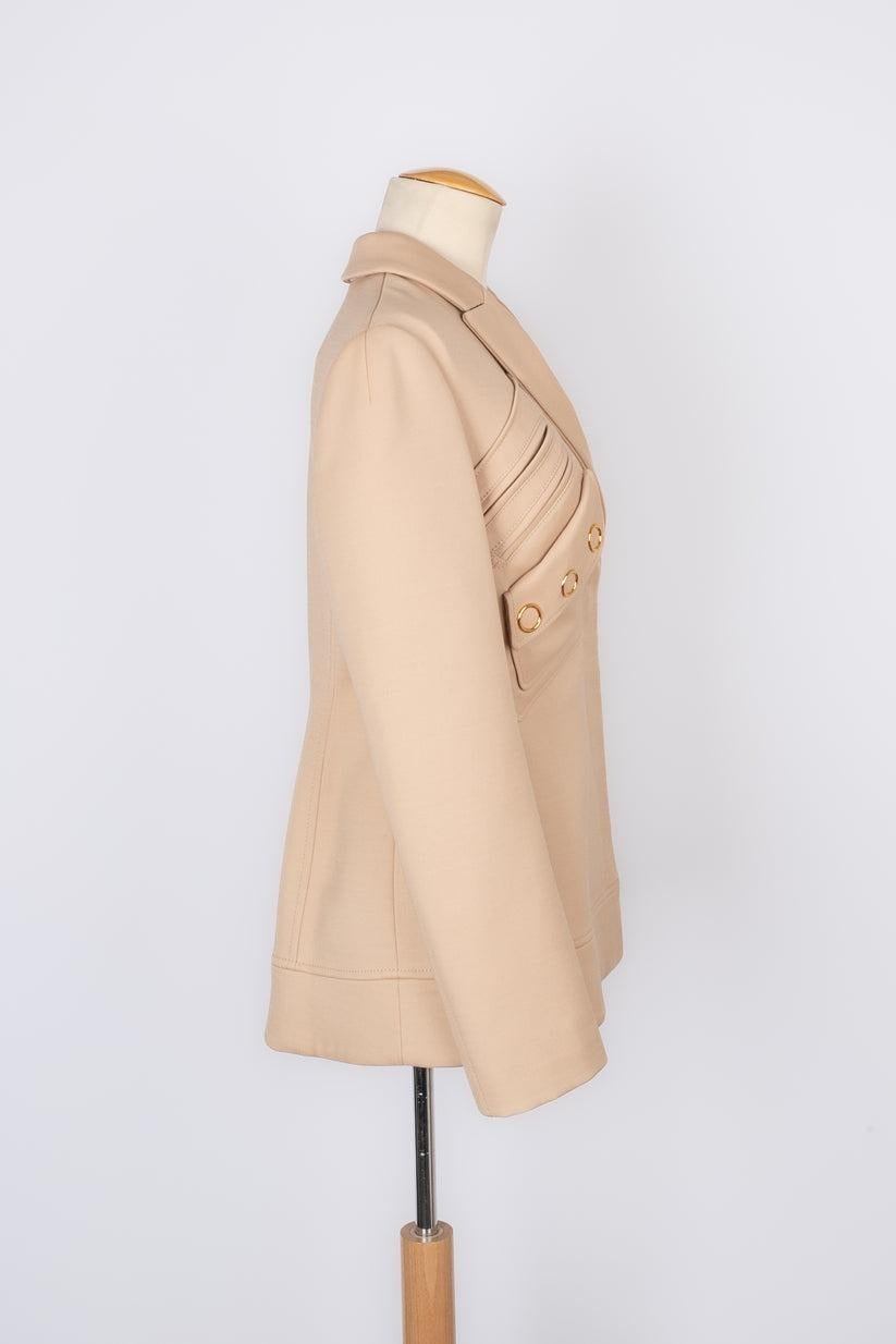 Dior - (Made in Italy) Beige silk and wool jacket ornamented with golden metal. 38FR size indicated. 2017 Resort Collection.

Additional information:
Condition: Very good condition
Dimensions: Shoulder width: 38 cm - Chest: 44 cm - Sleeve length: 62