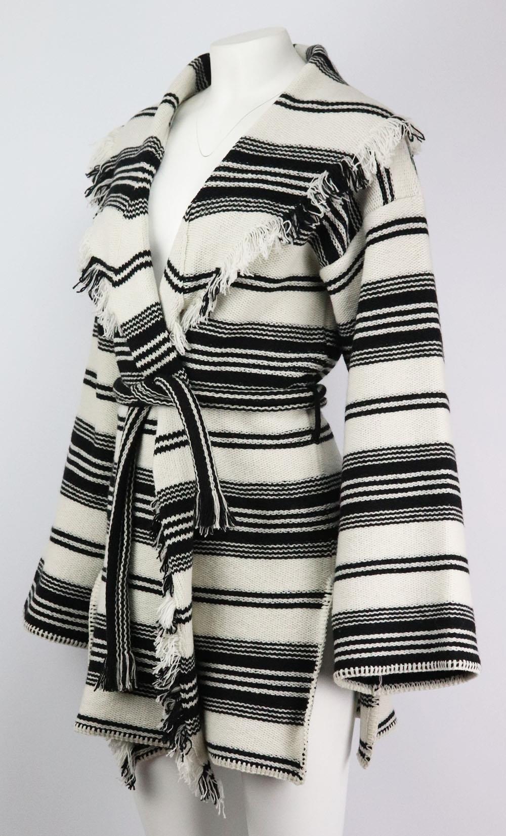 This cardigan by Christian Dior is spun from wool, this fringed design features bold stripes throughout and is finished with a belt to cinch in your waist. Black and ecru wool. Belt fastening at front. 100% Wool. Size: FR 40 (UK 12, US 8, IT 44).