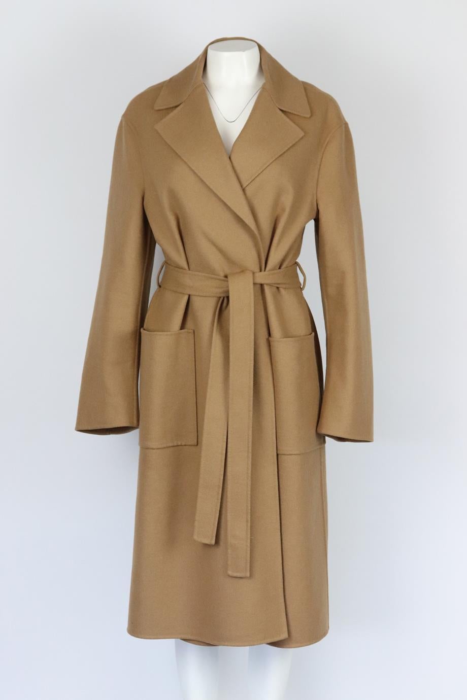 Christian Dior belted wool blend coat. Camel. Long sleeve, v-neck. Belt fastening at front. 82% Wool, 15% rabbit hair, 2% polyamide, 1% elastane. Size: FR 44 (UK 16, US 12, IT 48). Shoulder to shoulder: 20 in. Bust: 46 in. Waist: 48 in. Hips: 50 in.
